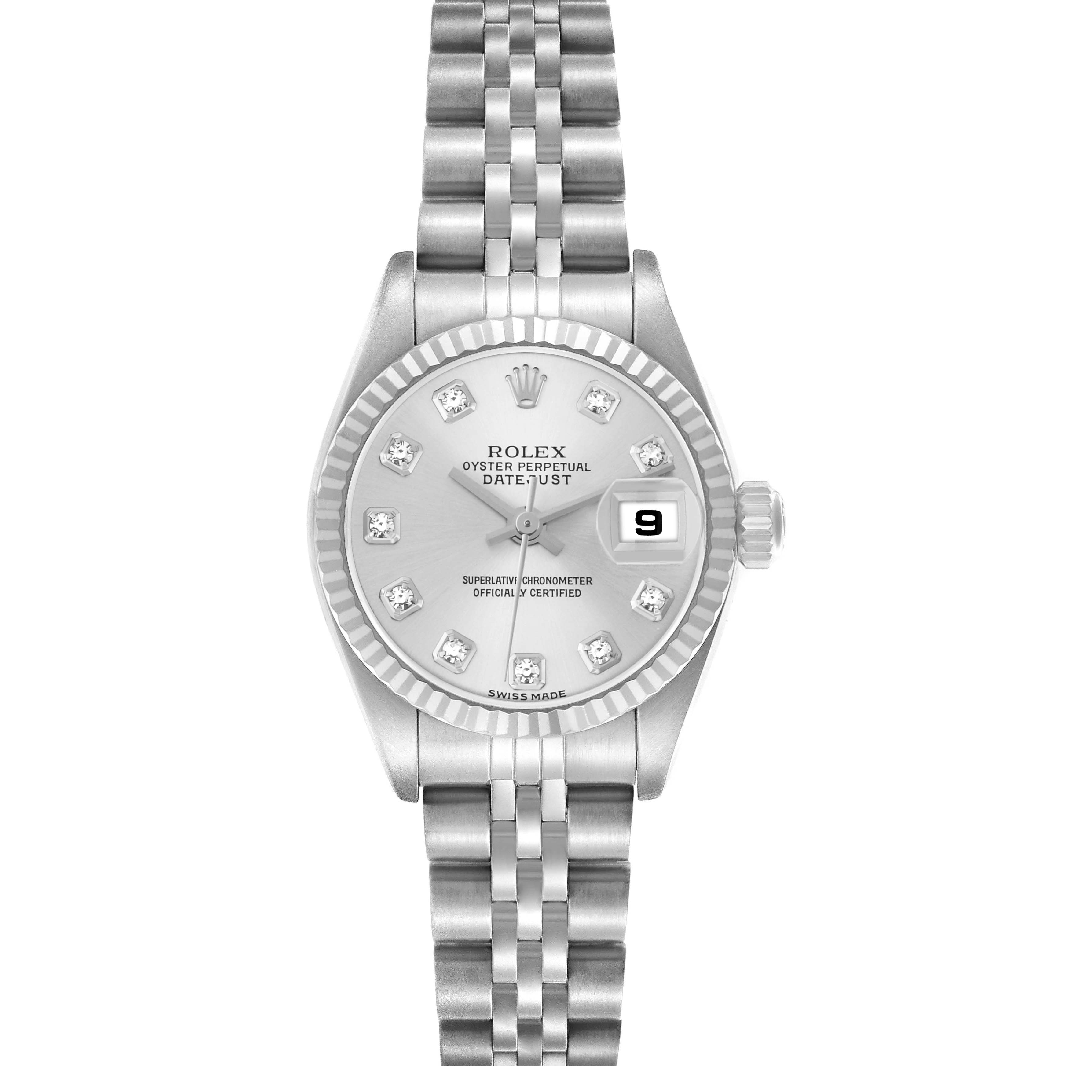 The Rolex Datejust 79174 watch is shown from a top-down angle, highlighting its silver dial, date window, and Jubilee bracelet.