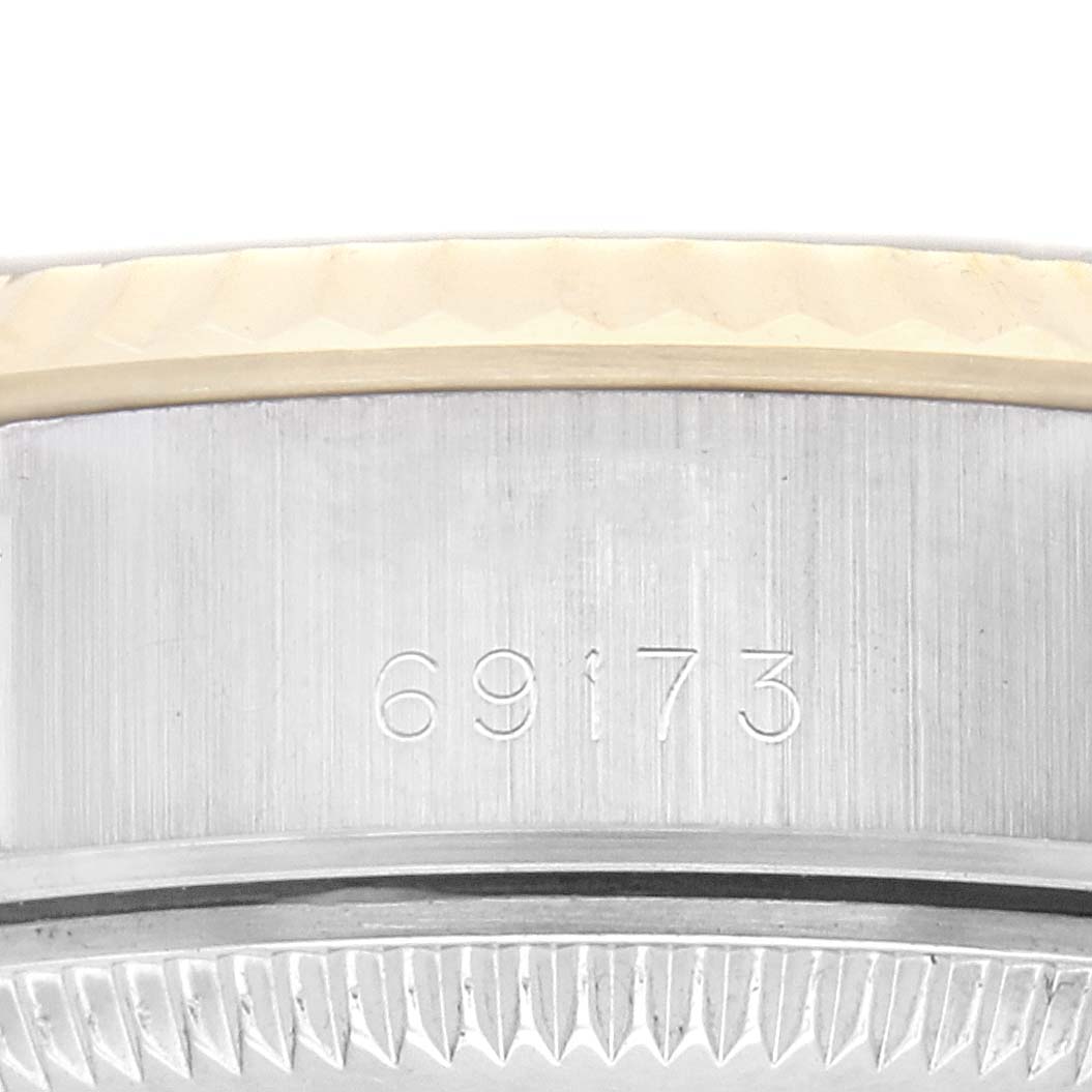 The image shows a close-up view of the side of a Rolex Datejust watch, model number 69173, focusing on the engraved part of the case.