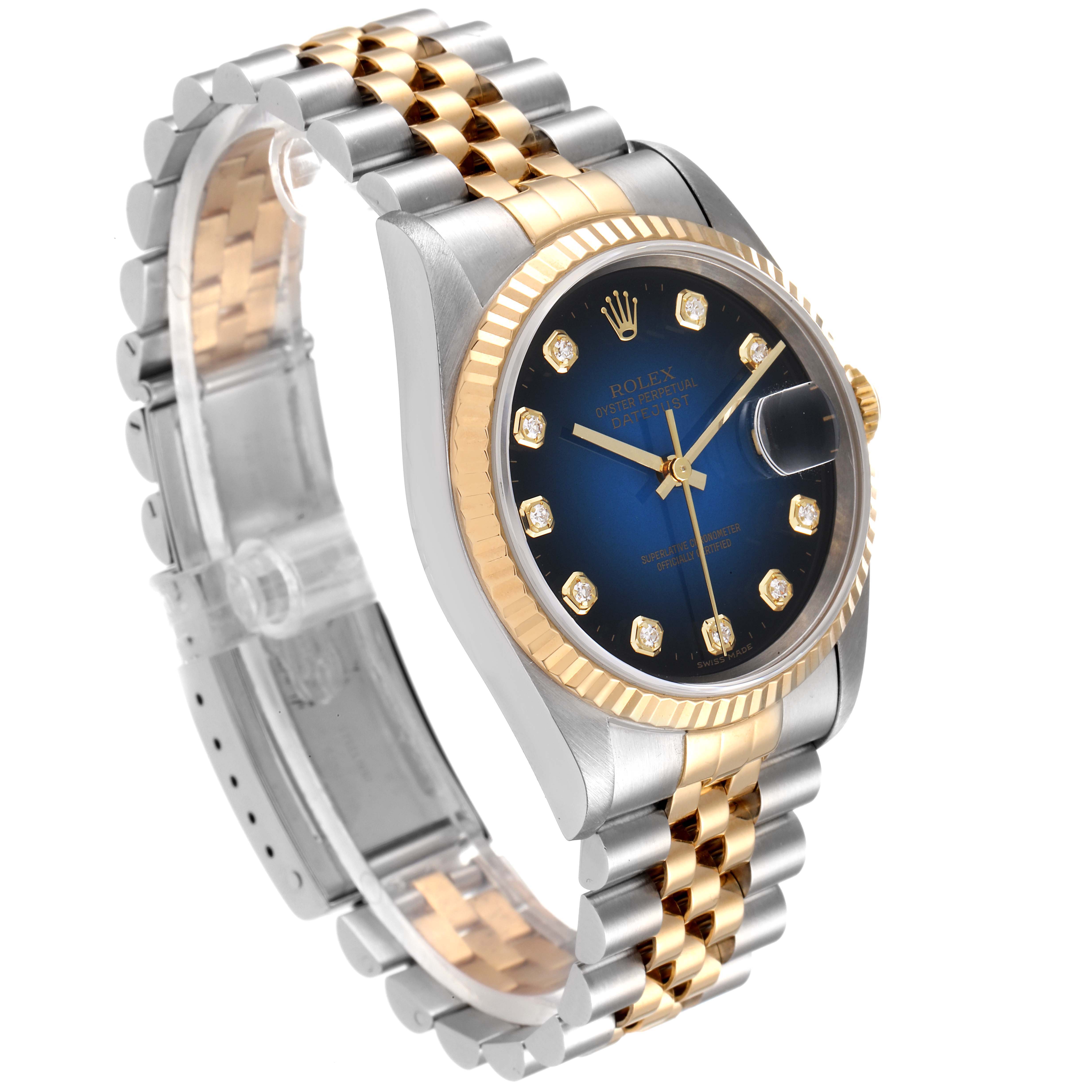 The image shows a Rolex Datejust 16233 Men's Steel and Gold (two tone) Blue Dial 16233 Men's Steel and Gold (two tone) Blue Dial watch at a three-quarter angle with a close-up of the face and bracelet.