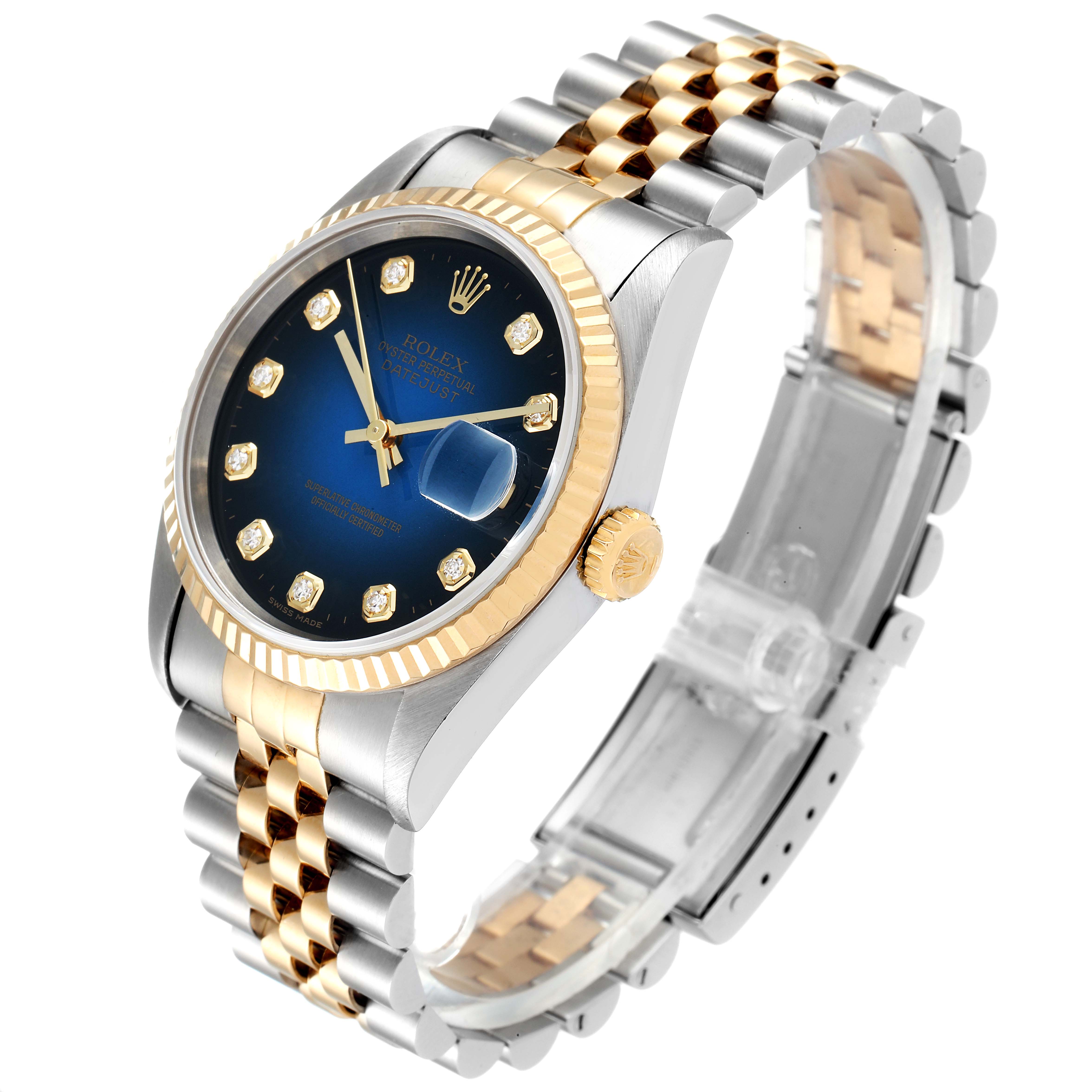 The Rolex Datejust 16233 Men's Steel and Gold (two tone) Blue Dial 16233 Men's Steel and Gold (two tone) Blue Dial watch is shown at an angle displaying its face, fluted bezel, crown, and two-tone Jubilee bracelet.