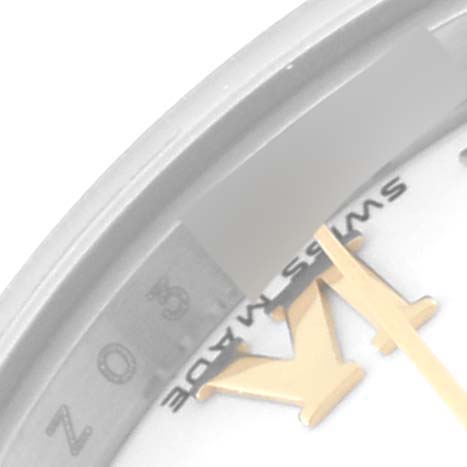 This is a close-up of the Rolex Datejust 179163 Women
s Steel and Gold (two tone) White Dial 179163 Women
s Steel and Gold (two tone) White Dial watch, showing the "Swiss Made" marking and part of the bezel.