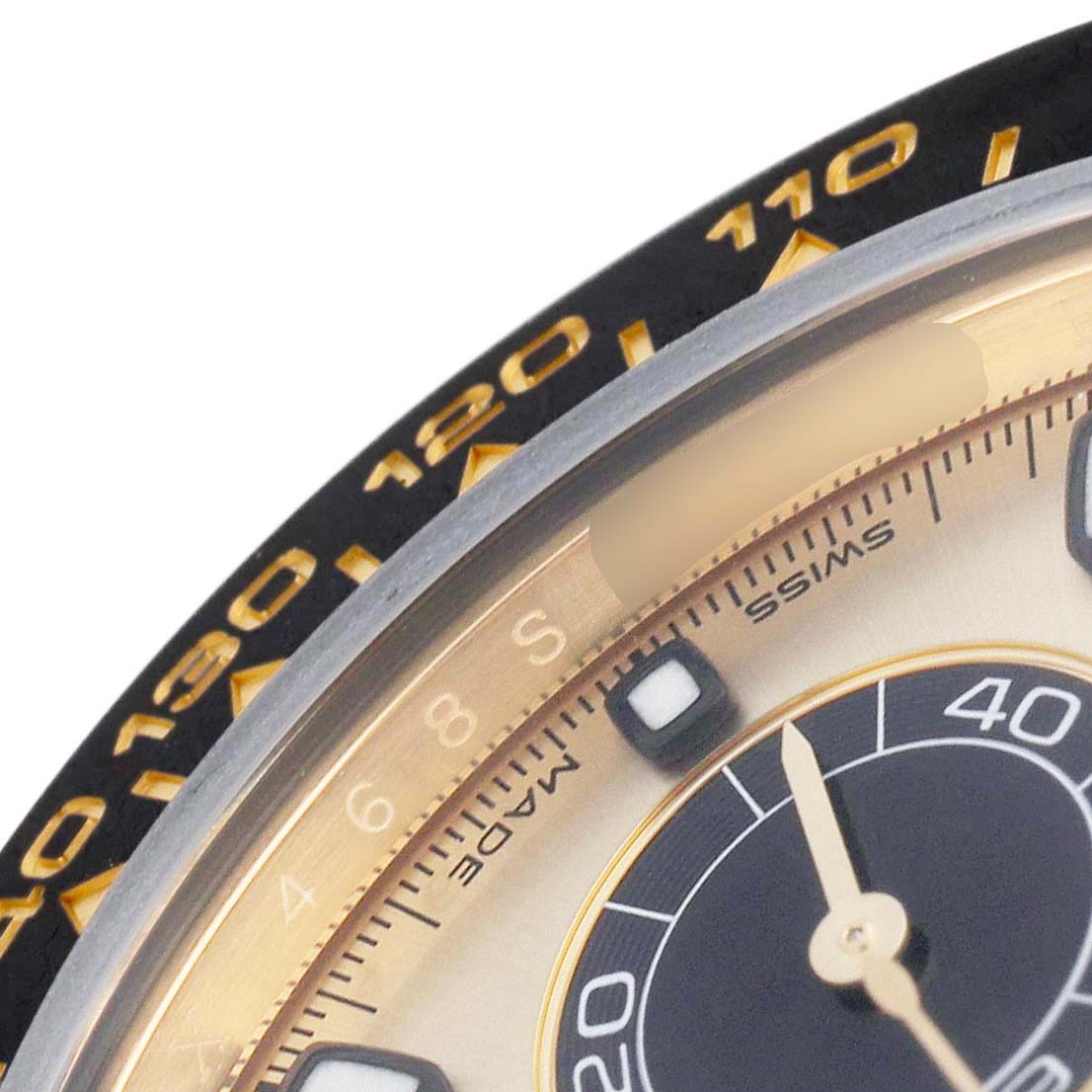 The image shows a partial close-up of the bezel and dial of a Rolex Daytona 116518LN Men's Yellow Gold Champagne Dial, highlighting the tachymetric scale.