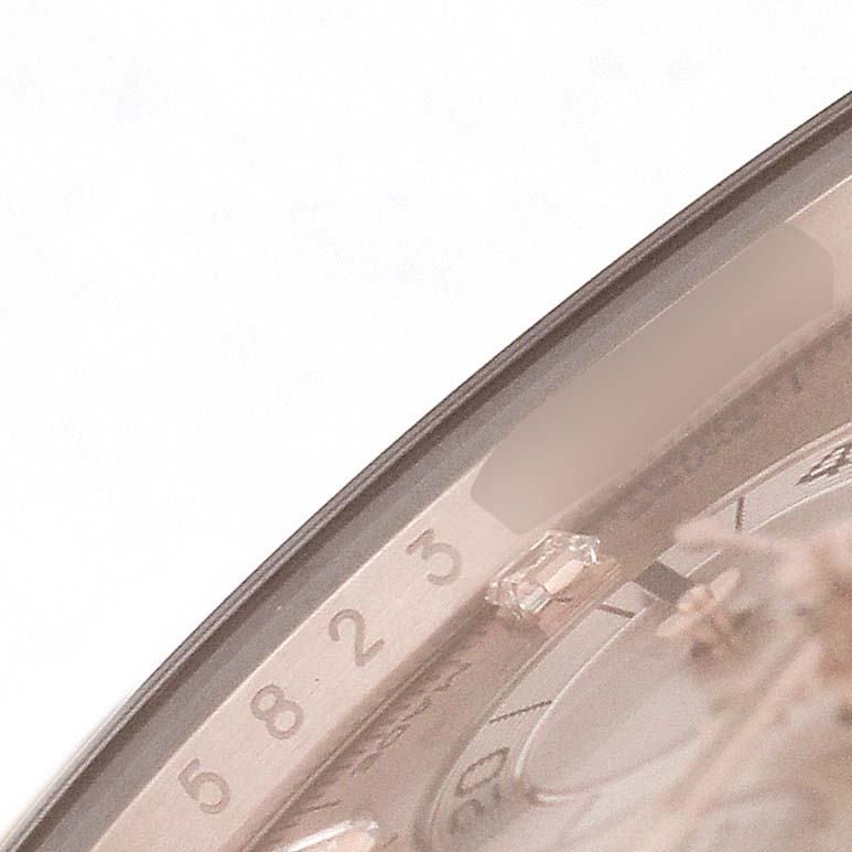 The image shows a close-up of the bezel and part of the dial of the Rolex Daytona 116515LN Men's Rose Gold Pink Dial, highlighting the numbers and edge details.