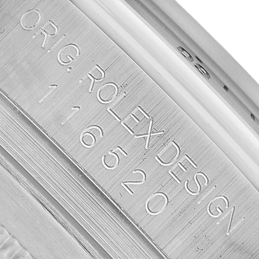 This image shows a close-up of the engraved case side of a Rolex Daytona 116520 Men's Stainless Steel White Dial watch, highlighting the model number.
