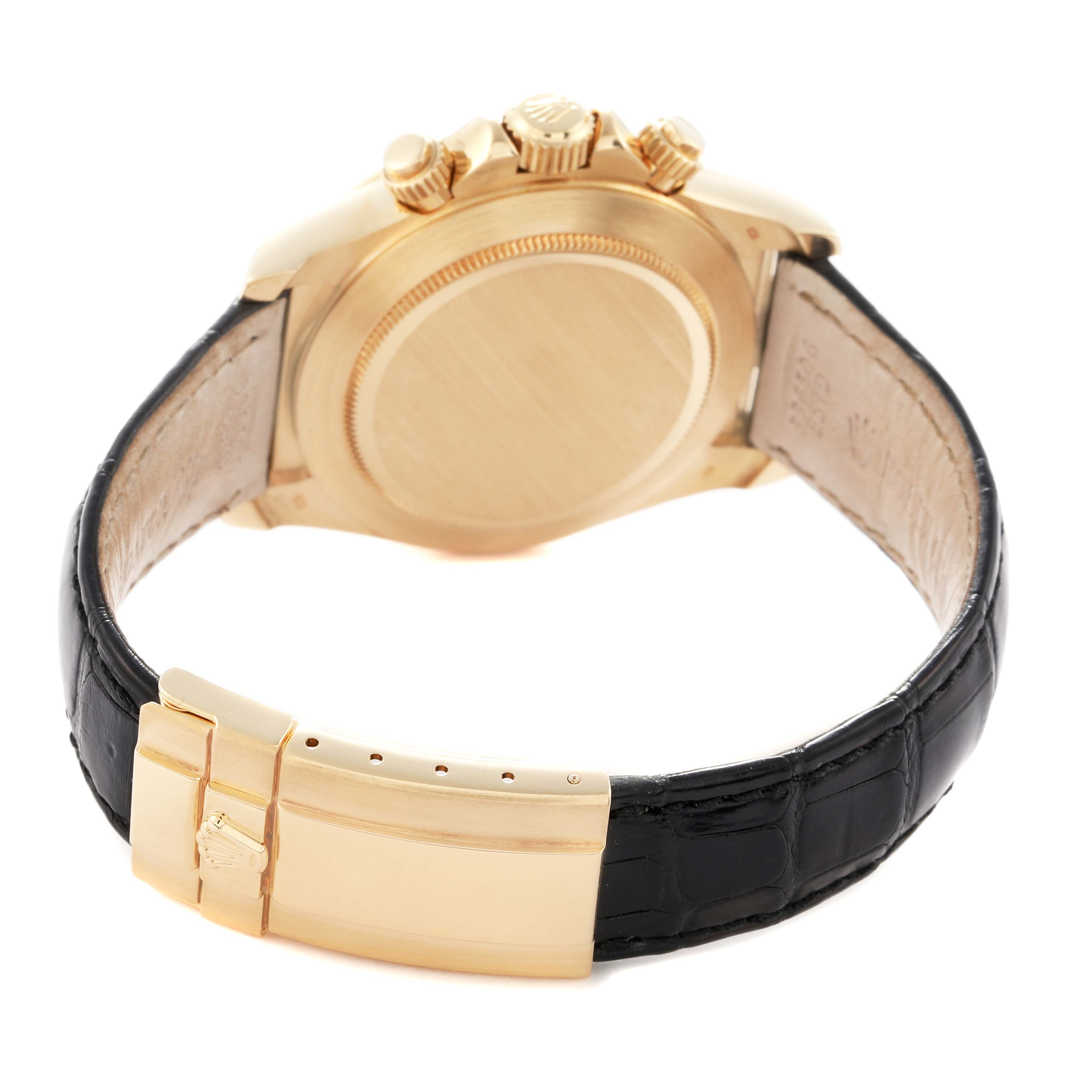 The image shows the back and side angle of the Rolex Daytona model 16518, featuring the case back, crown, pushers, and leather strap with a gold buckle.