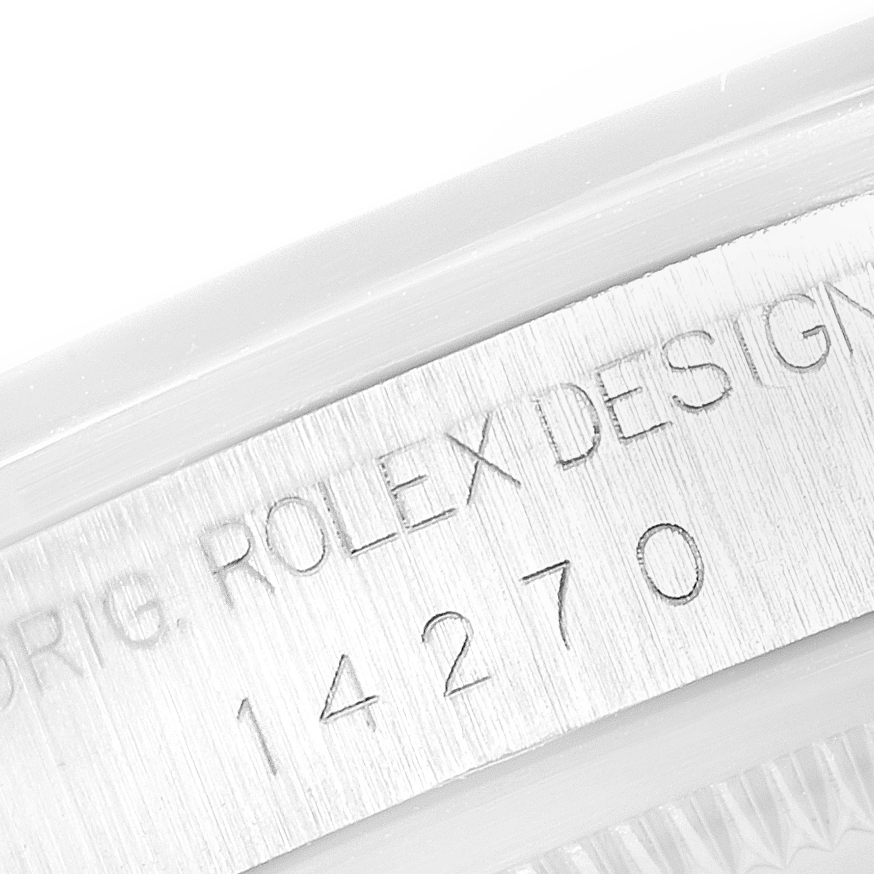 This close-up image of the Rolex Explorer 14270 Men's Stainless Steel Black Dial 14270 Men's Stainless Steel Black Dial watch shows the engraved text on the case side.