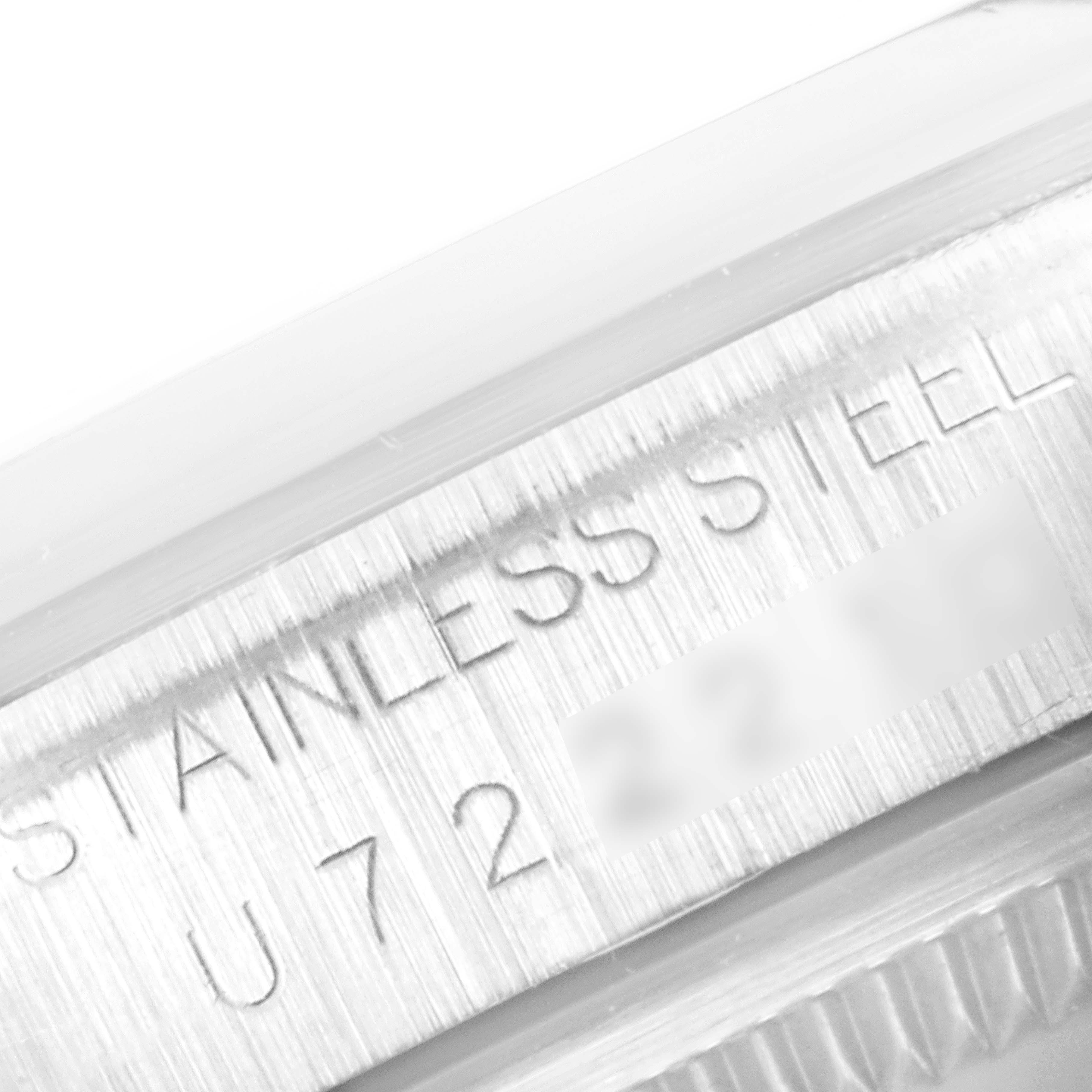 The image shows a close-up view of the stainless steel engraving on a Rolex Explorer 14270 Men's Stainless Steel Black Dial 14270 Men's Stainless Steel Black Dial model watch case.