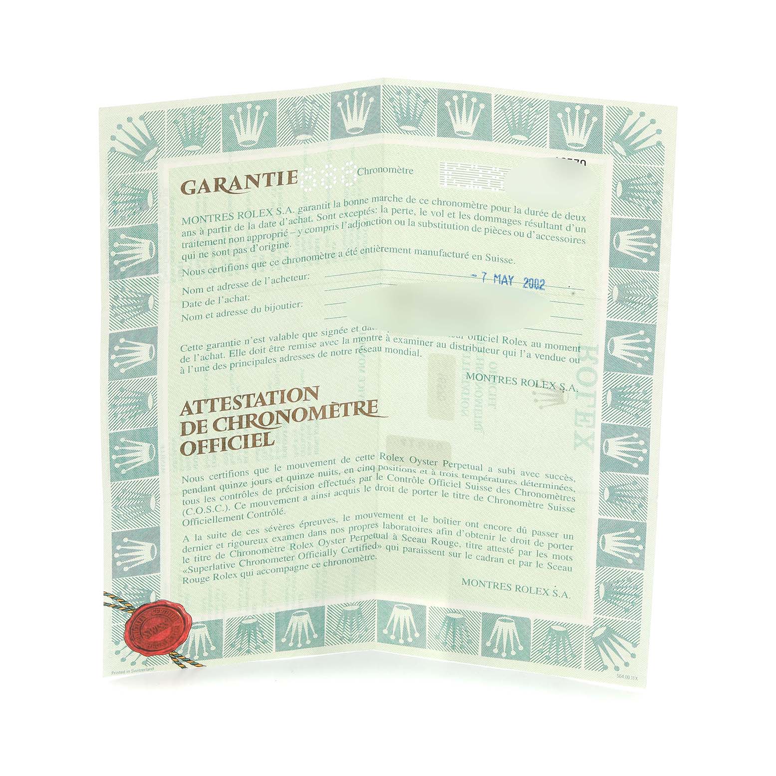 The image shows a warranty certificate for a Rolex Explorer model 16570, highlighting details and official Rolex branding.