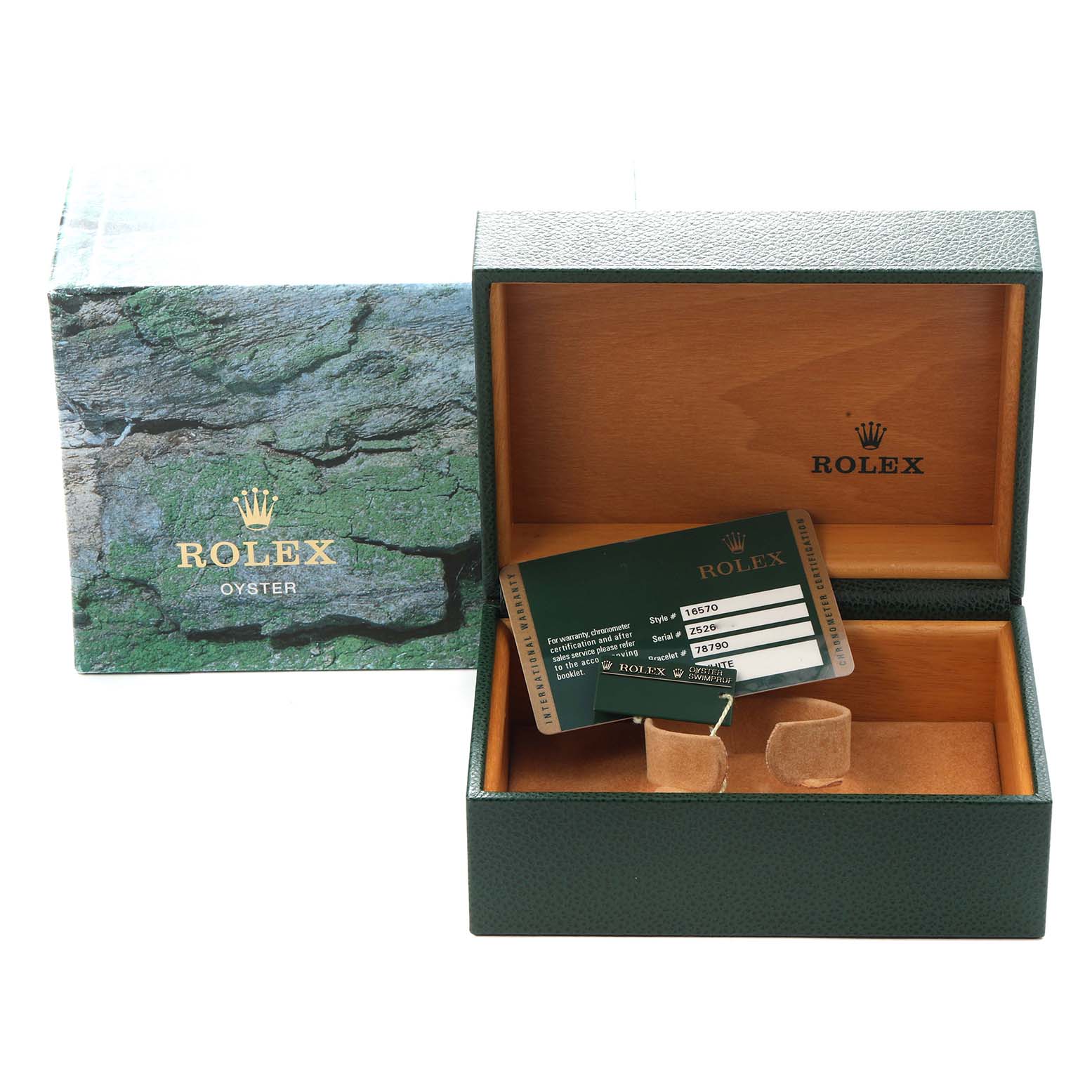 The image shows a Rolex Explorer model 16570 with its green box, warranty card, and inner cushion, but the watch itself is not visible.