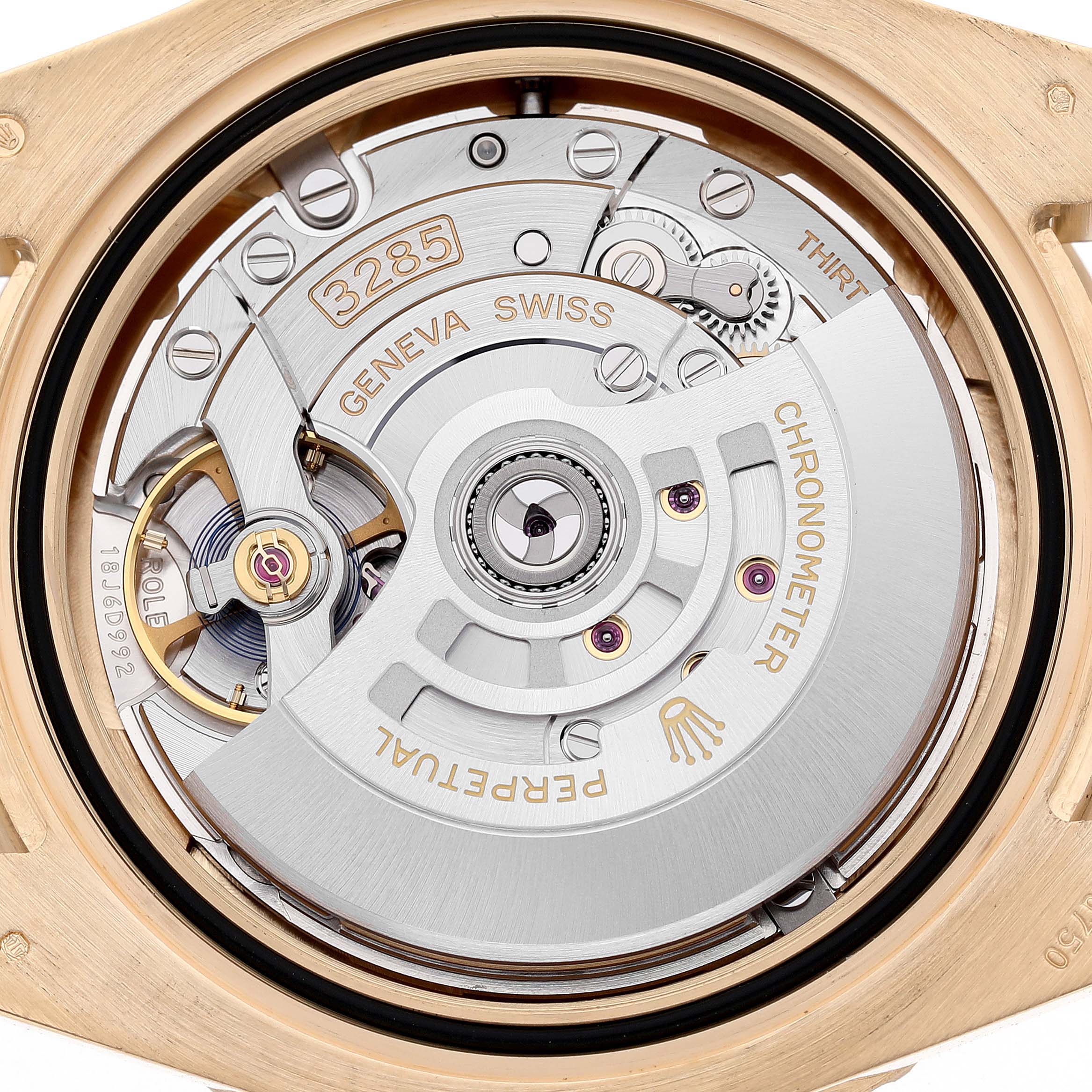 The image shows the movement of a Rolex GMT-Master 126718GRNR Men's Yellow Gold Black Dial, highlighting the mechanical components from the back.