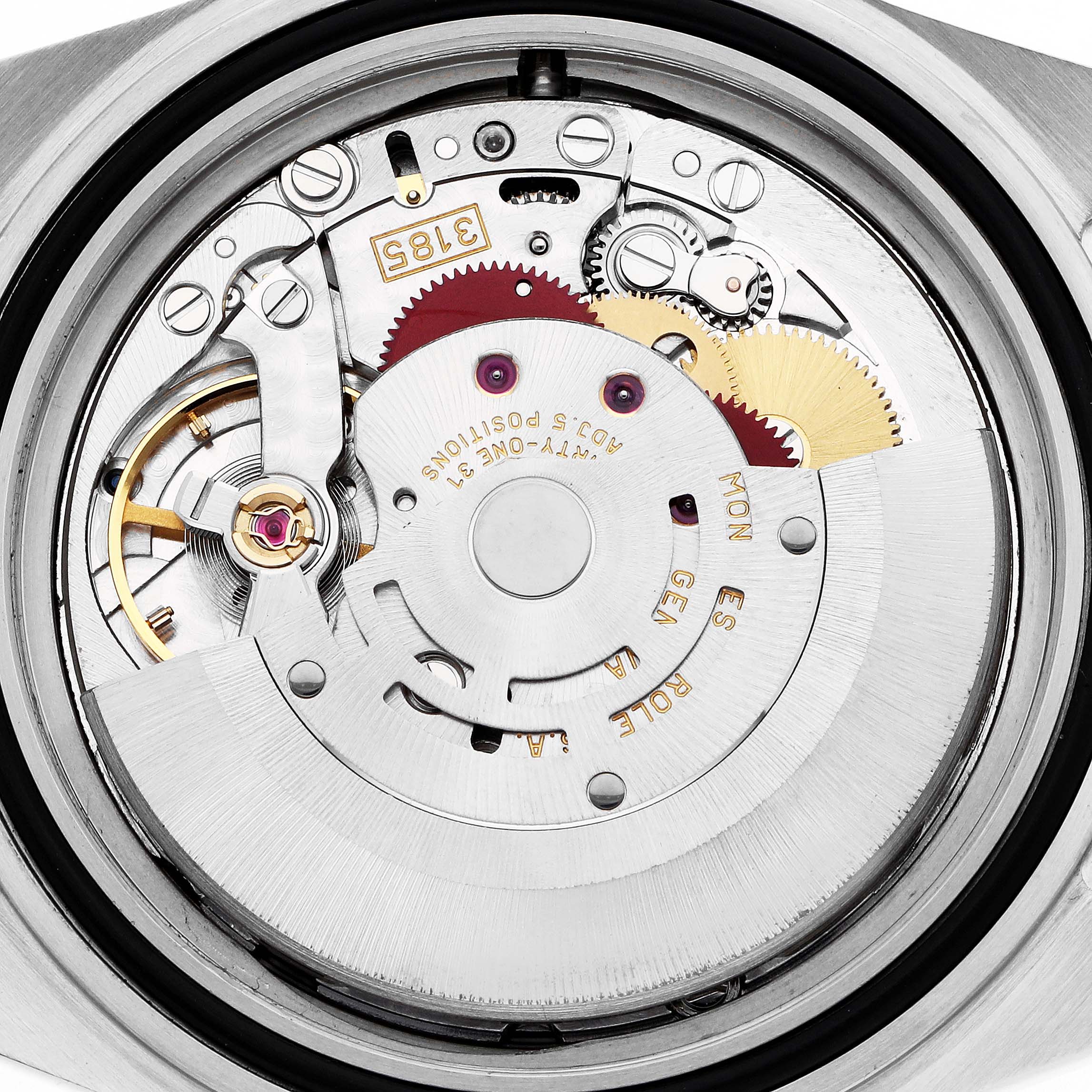 The image shows the inner mechanical movement of the Rolex GMT-Master model 16710, showcasing gears and the rotor at a top-down angle.