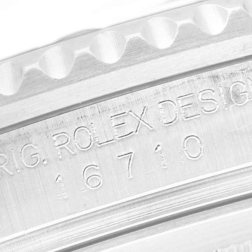 The image shows an engraved side view of the Rolex GMT-Master model 16710 case, focusing on the bezel edge and the model number inscription.