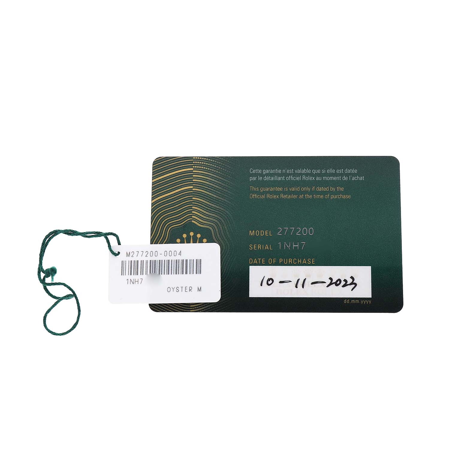 The image shows a Rolex warranty card and tag for a Mid-Size model, displayed from a top-down angle.
