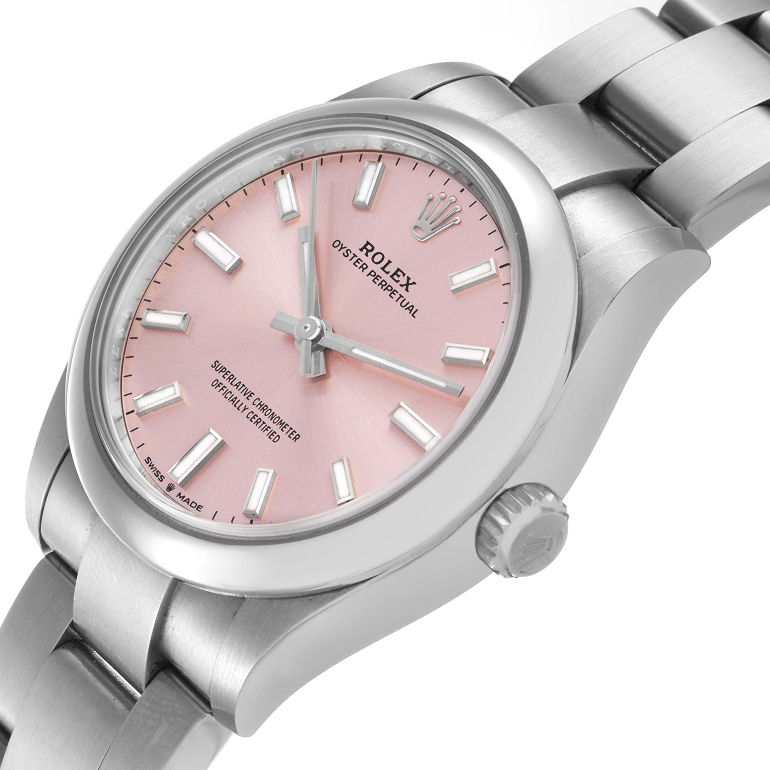 The Rolex Mid-Size 277200 Women's Stainless Steel Pink Dial watch is shown from an angled view, highlighting the pink dial, bezel, crown, and part of the bracelet.