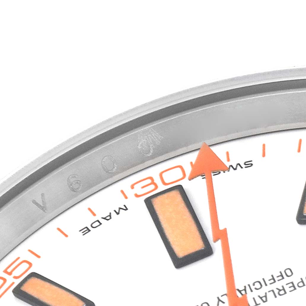 This close-up view of the Rolex Milgauss 116400 Men's Stainless Steel White Dial 116400 Men's Stainless Steel White Dial shows part of the dial, an orange hour marker, and the orange second hand.