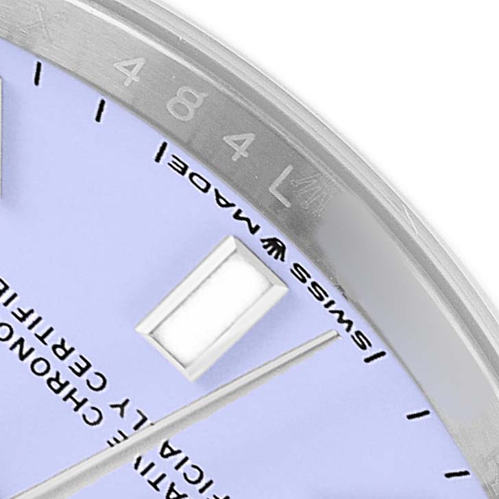 This image shows a close-up of the dial, hands, and bezel of a Rolex Oyster Perpetual M124200-0003 Men's Stainless Steel Purple Dial watch.