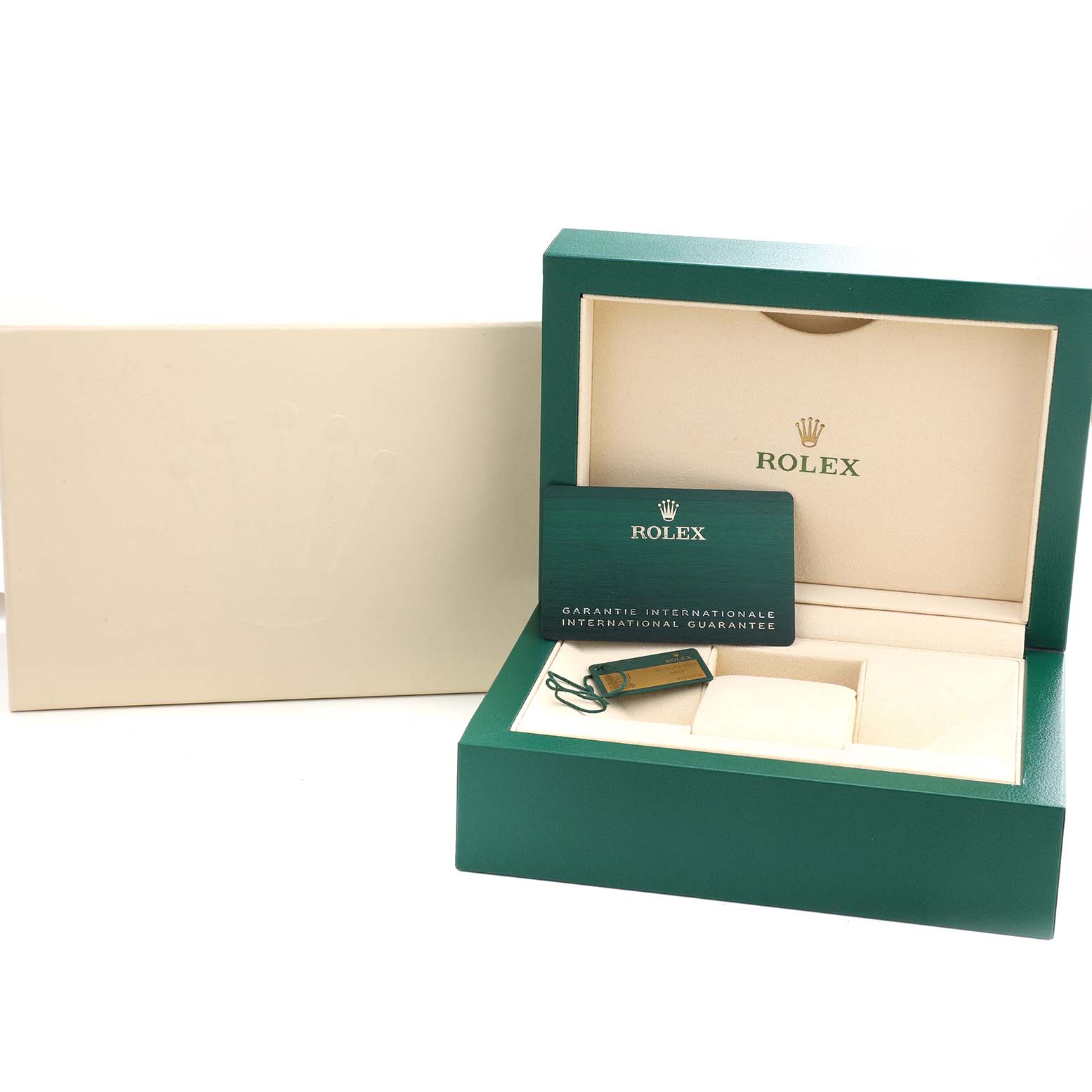 The image shows an open green Rolex box for an Oyster Perpetual watch, along with the international guarantee card.