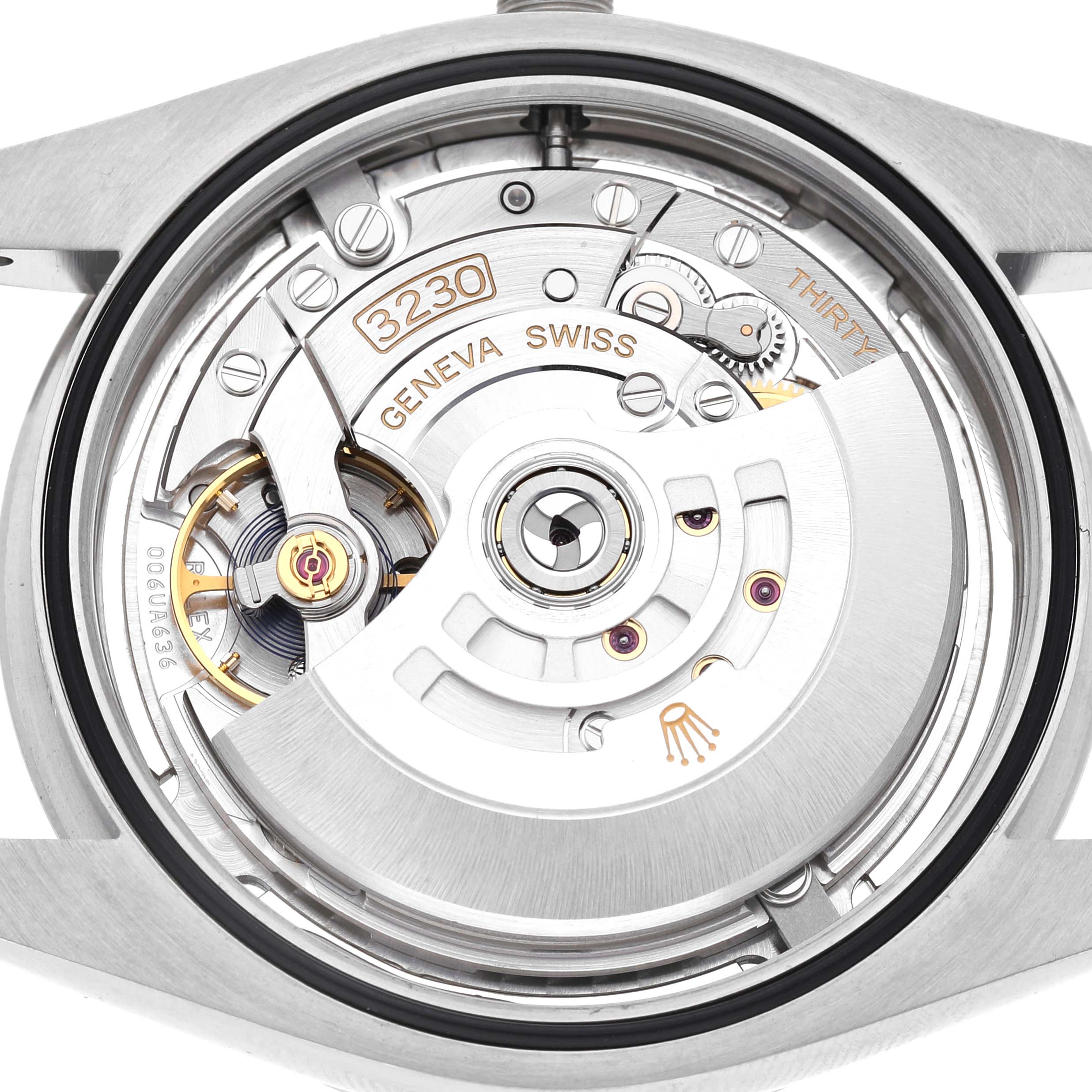 The image shows the movement of the Rolex Oyster Perpetual 124300 Men's Stainless Steel Silver Dial from the back, highlighting its intricate mechanical parts.