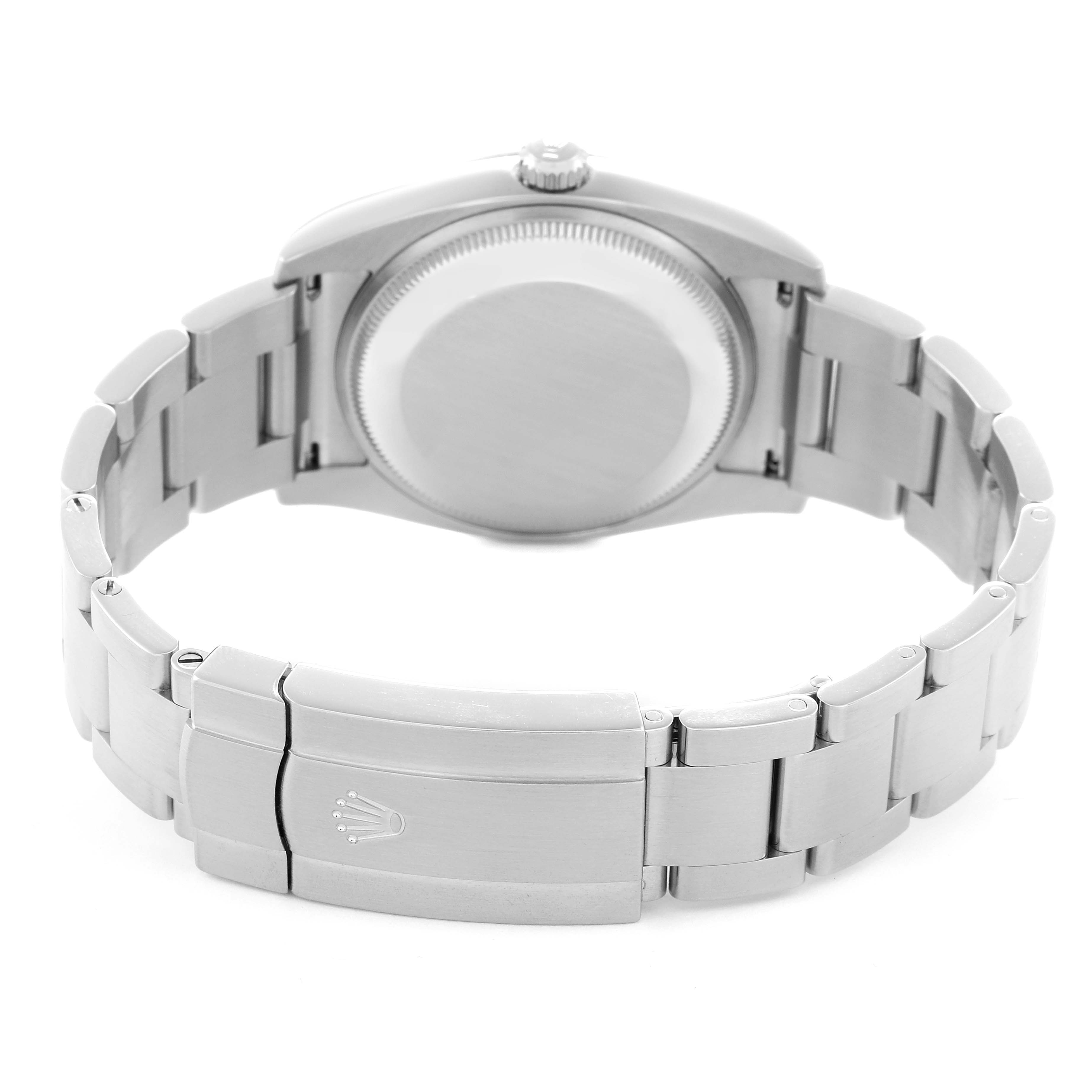 The image shows the back and clasp of the Rolex Oyster Perpetual, model 114200, featuring its bracelet and closed case back from a rear angle.