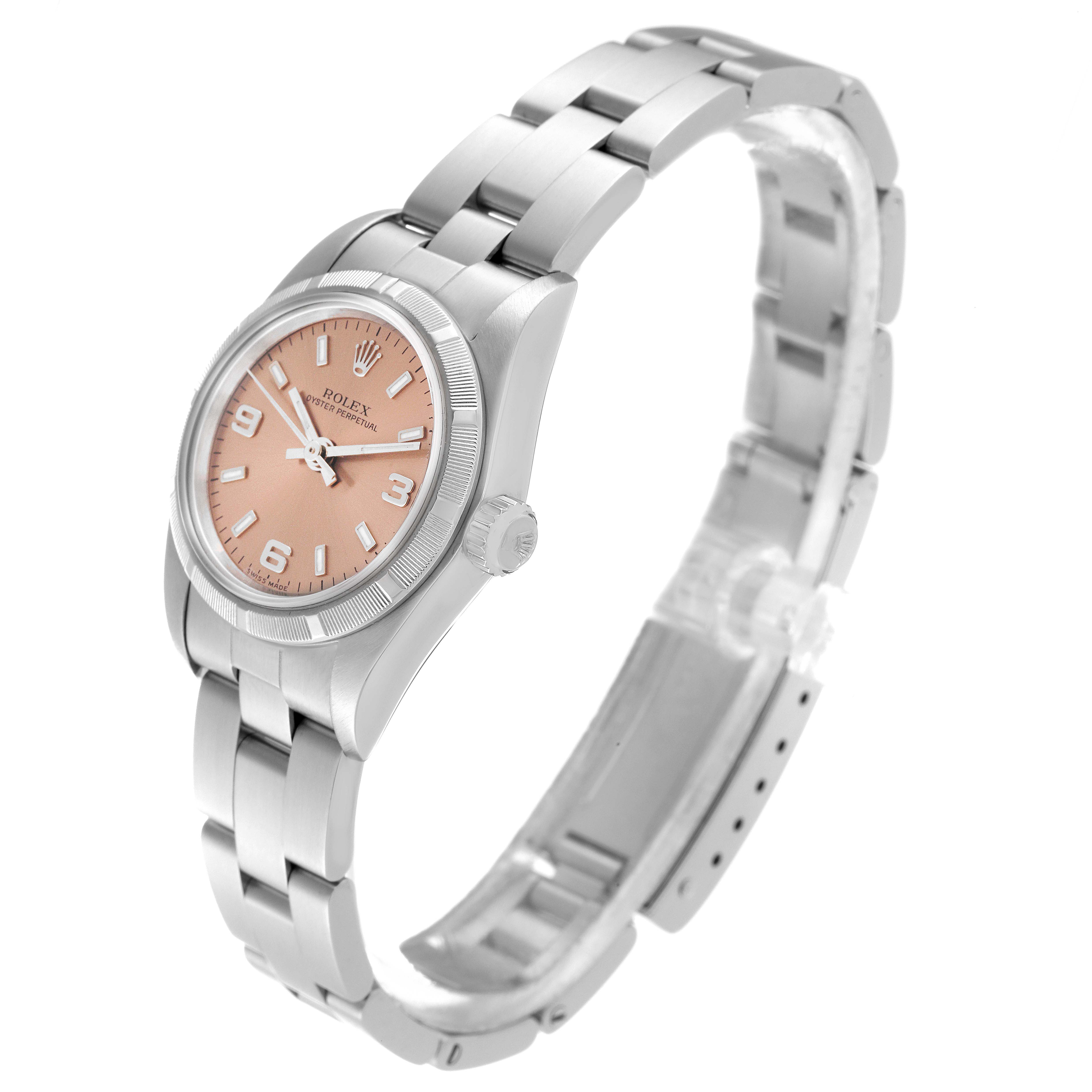 The image shows an angled view of the Rolex Oyster Perpetual 76030 Women's Stainless Steel Pink Dial 76030 Women's Stainless Steel Pink Dial watch, highlighting its face, bezel, and stainless steel bracelet.
