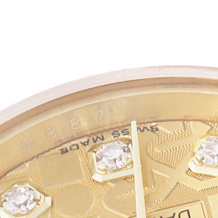 This close-up image of the Rolex President 179178 Women's Yellow Gold Champagne Dial 179178 Women's Yellow Gold Champagne Dial watch shows part of the dial, some of the hour markers, and the bezel.