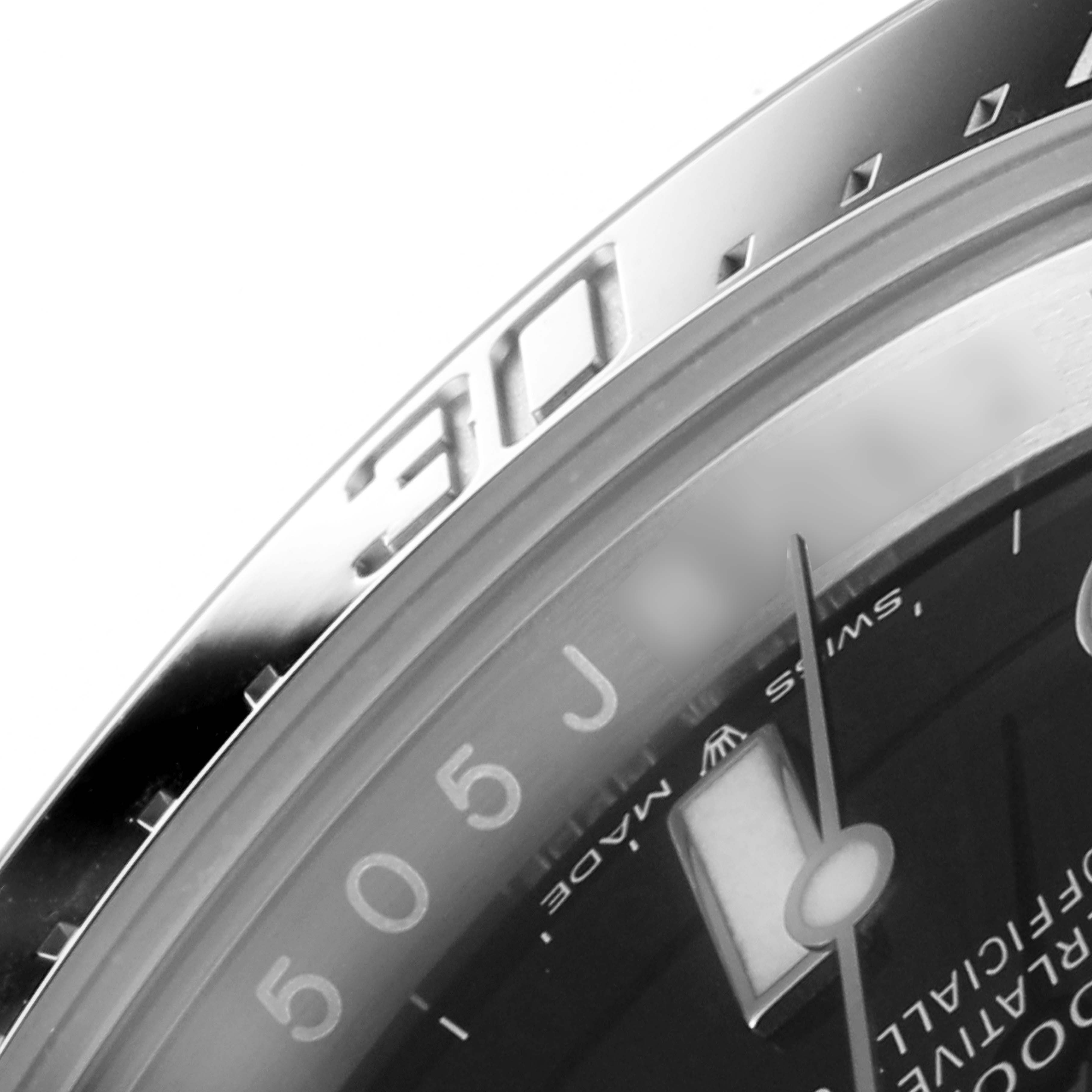 The image shows a close-up of the bezel and a portion of the dial of a Rolex Sea-Dweller 126600 Men
s Stainless Steel Black Dial 126600 Men
s Stainless Steel Black Dial watch.