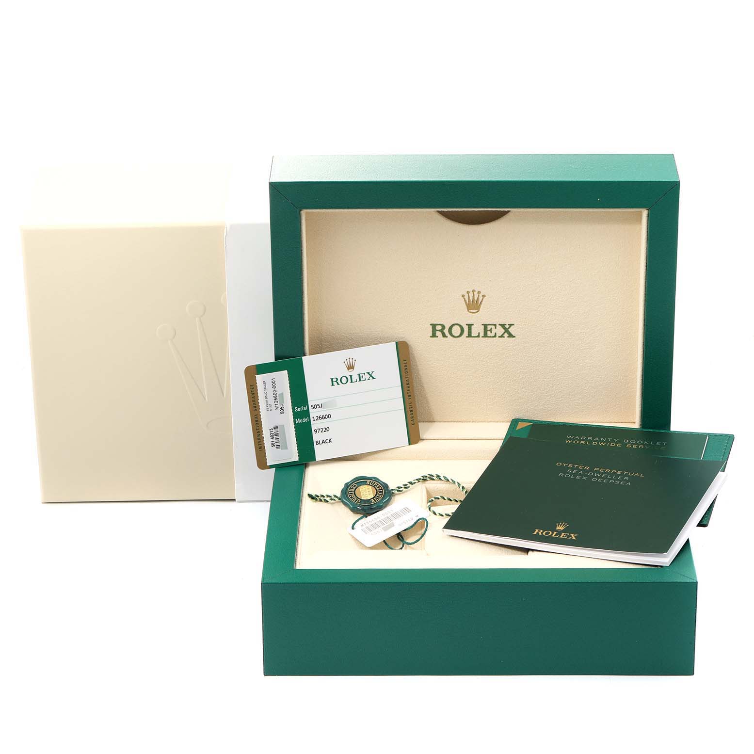 The image shows a Rolex Sea-Dweller 126600 Men
s Stainless Steel Black Dial 126600 Men
s Stainless Steel Black Dial watch box with warranty card, booklet, tag, and accessories from a front angle.