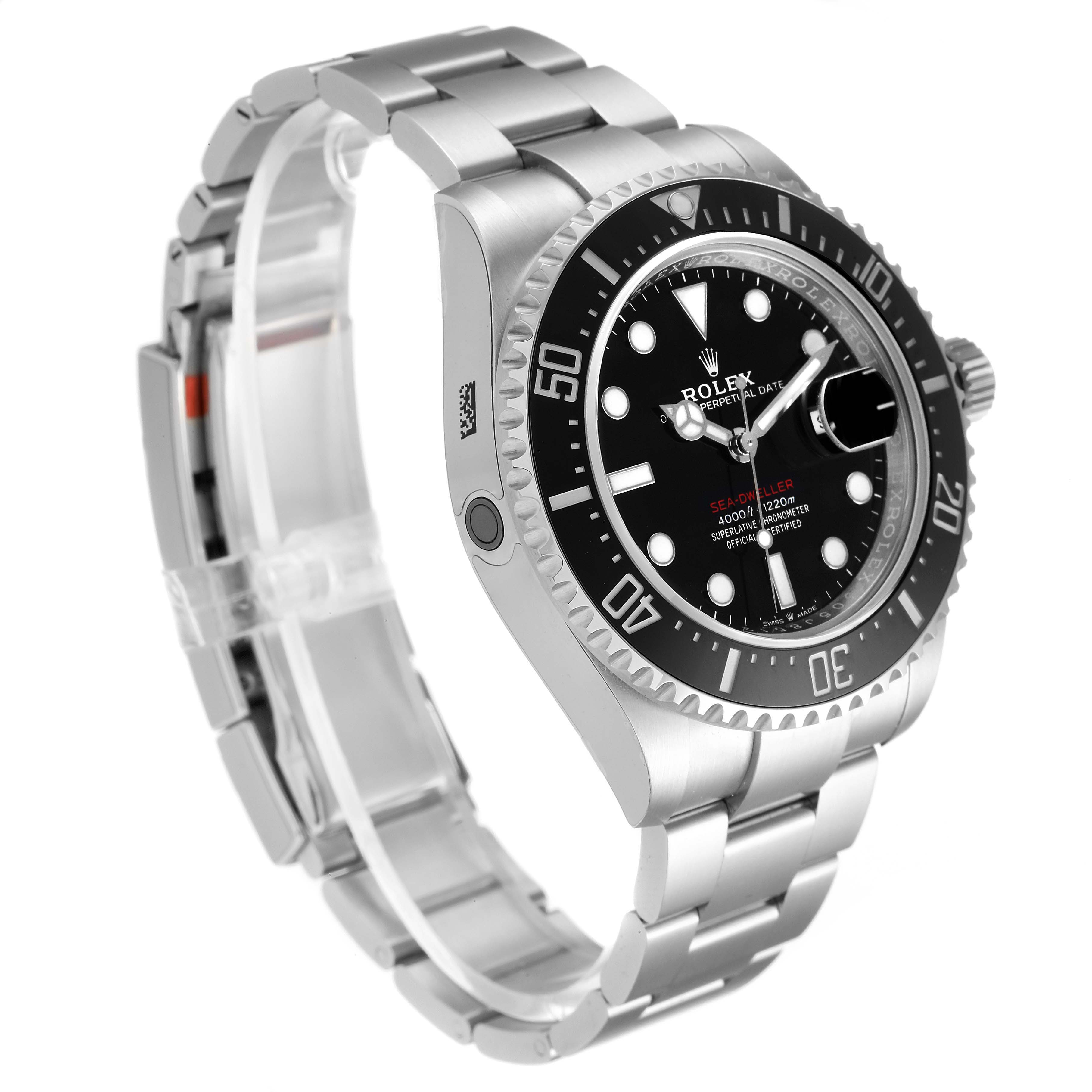 The image shows a side-angle view of a Rolex Sea-Dweller 126600 Men
s Stainless Steel Black Dial 126600 Men
s Stainless Steel Black Dial watch, highlighting the dial, bezel, and stainless steel bracelet.