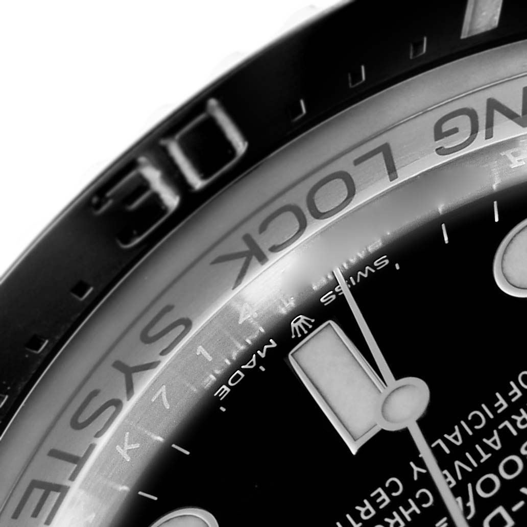 This close-up image of the Rolex Sea-Dweller 126660 Men
s Stainless Steel Black Dial 126660 Men
s Stainless Steel Black Dial watch showcases the bezel, part of the dial, and the "RING LOCK SYSTEM" engraving.