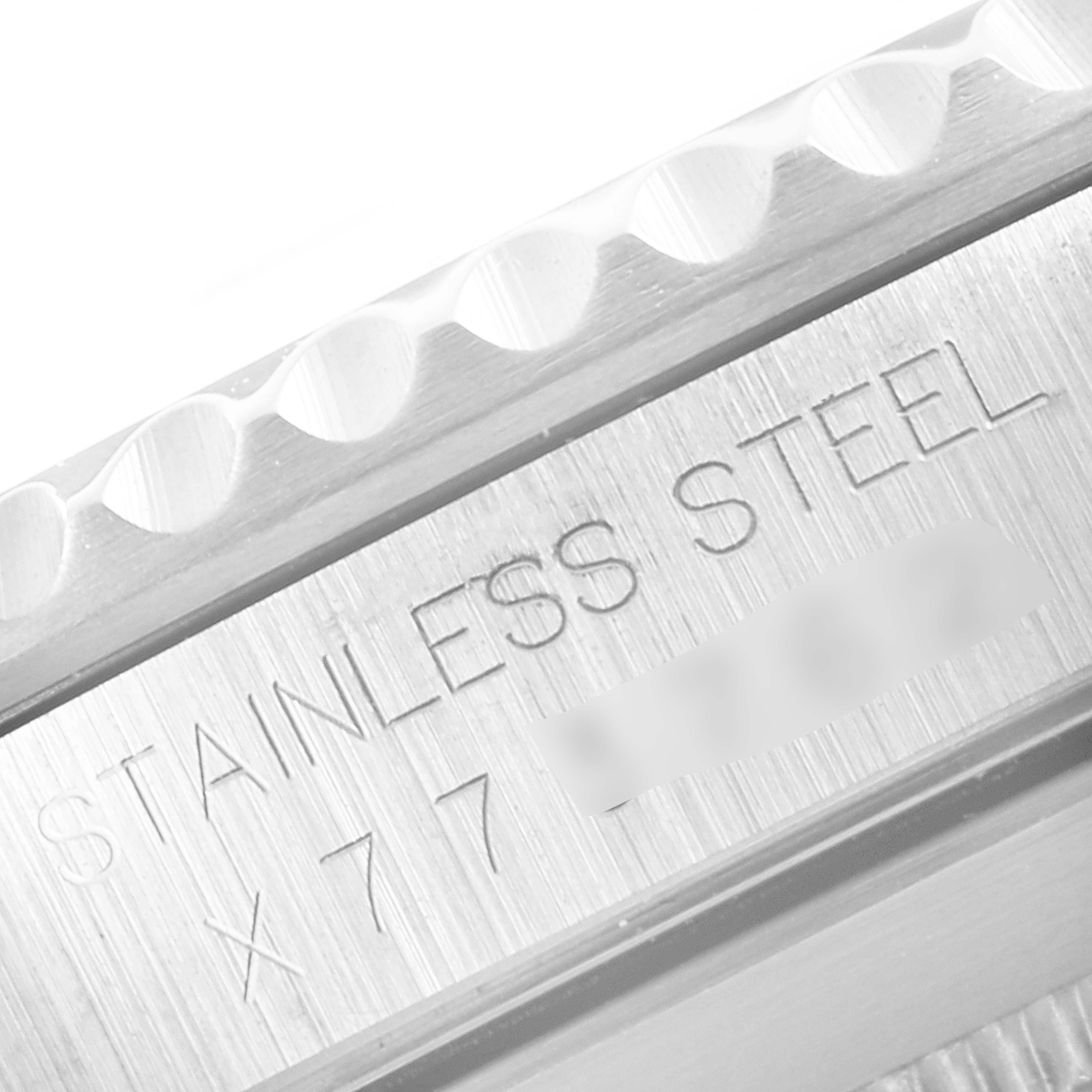 This close-up image shows the side engraving on the case of a Rolex Submariner 14060 Men
s Stainless Steel Black Dial 14060 Men
s Stainless Steel Black Dial, indicating "STAINLESS STEEL."