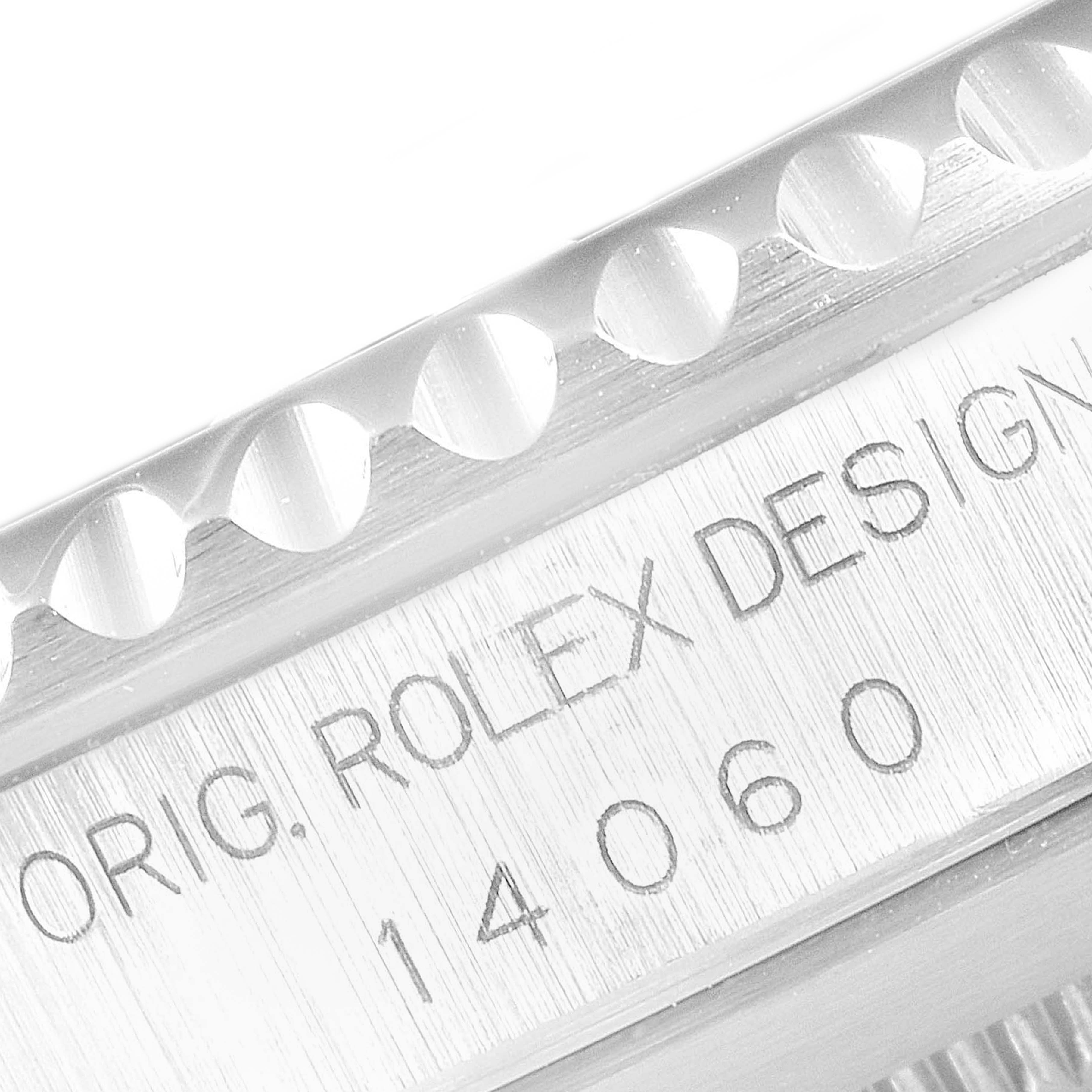 This close-up image shows the engraved serial number and design text on the side of the case of a Rolex Submariner 14060 Men
s Stainless Steel Black Dial 14060 Men
s Stainless Steel Black Dial 14060.