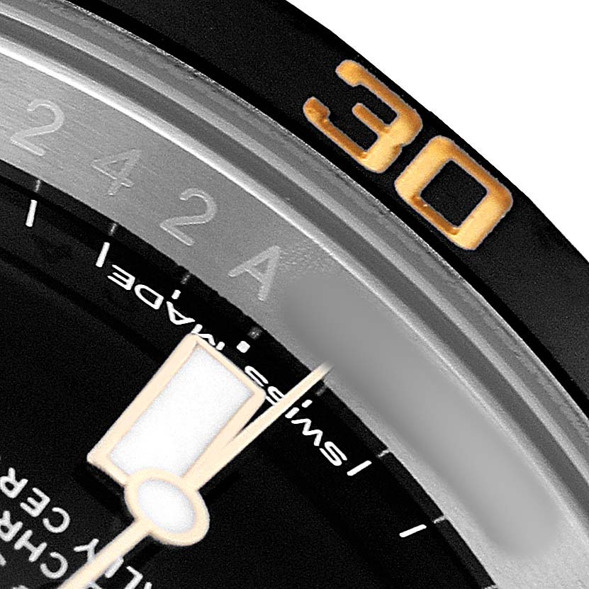 The image shows a close-up of the Rolex Submariner 116613LN Men's Steel and Gold (two tone) Black Dial's bezel and part of the dial, highlighting the number "30."
