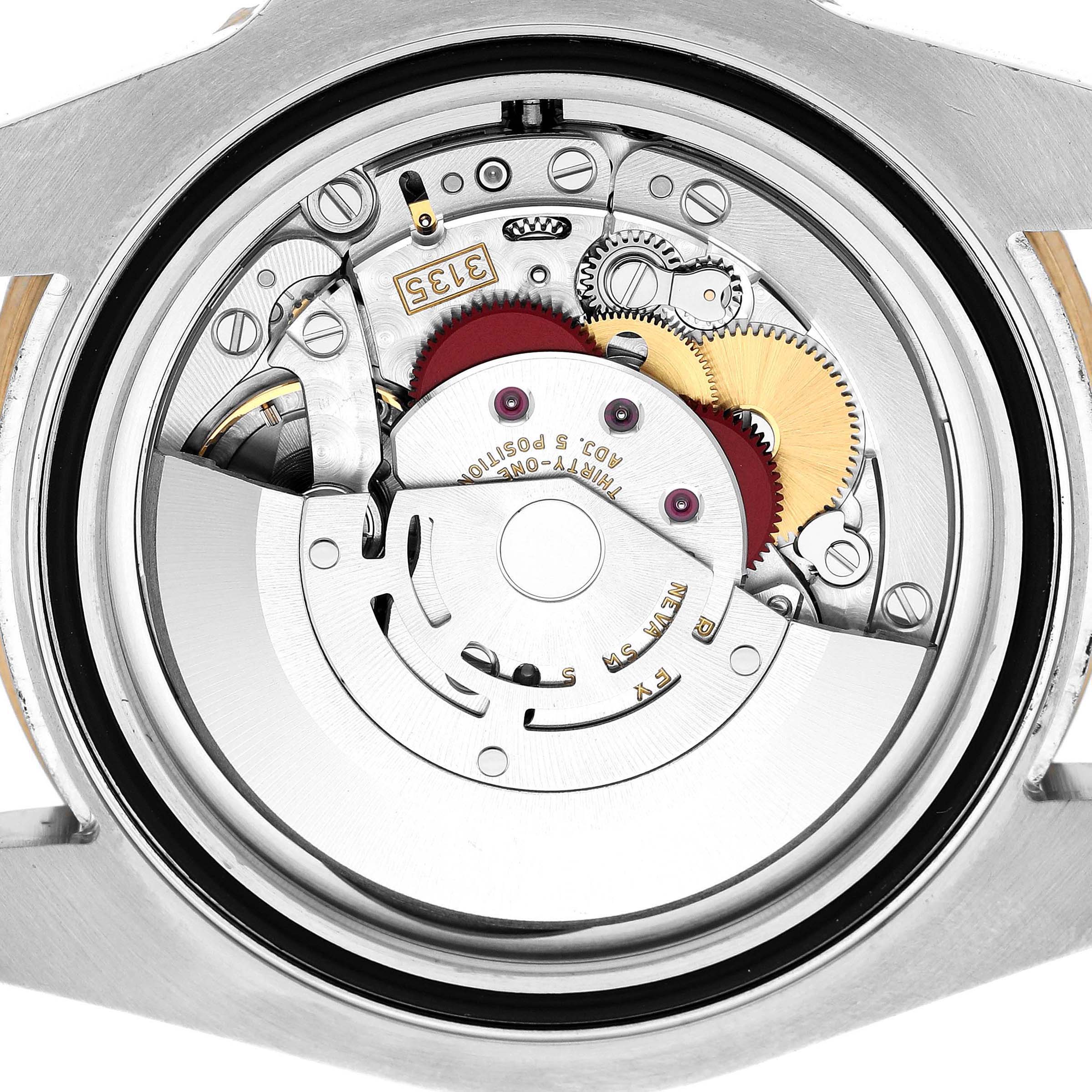 The image shows the movement of a Rolex Submariner 116613LN Men's Steel and Gold (two tone) Black Dial watch from a back view, highlighting gears and the rotor.