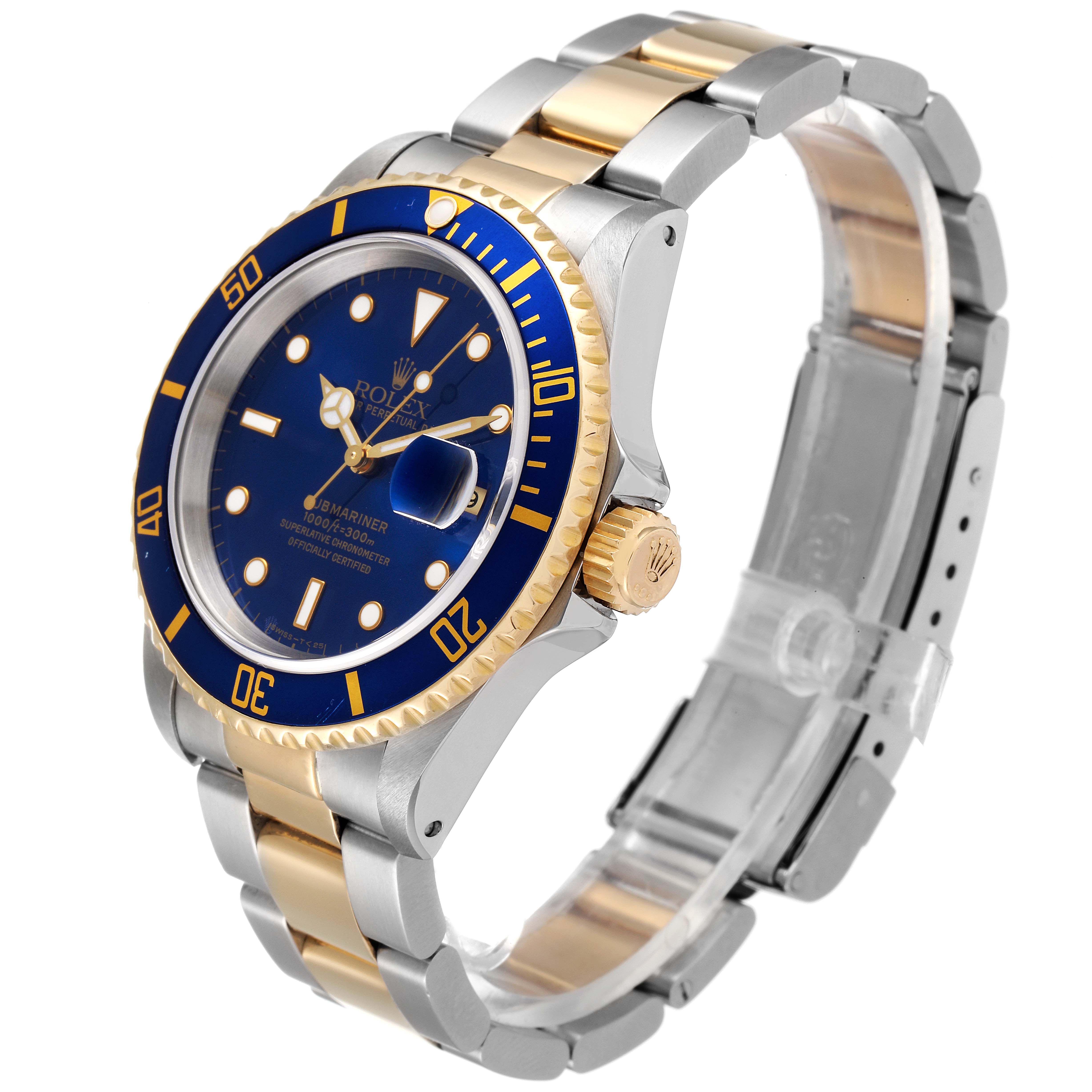 The image shows a Rolex Submariner 16613 Men's Steel and Gold (two tone) Blue Dial 16613 Men's Steel and Gold (two tone) Blue Dial watch at a three-quarter angle, highlighting its blue dial, bezel, and two-tone metal bracelet.