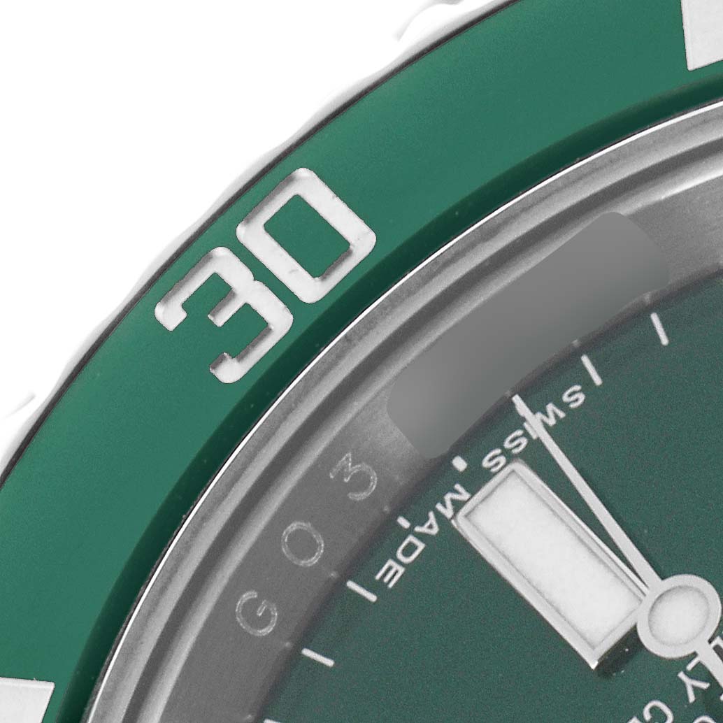The image shows a close-up of the bezel and part of the dial of a Rolex Submariner model 116610, highlighting the "30" marker and "Swiss Made" text.