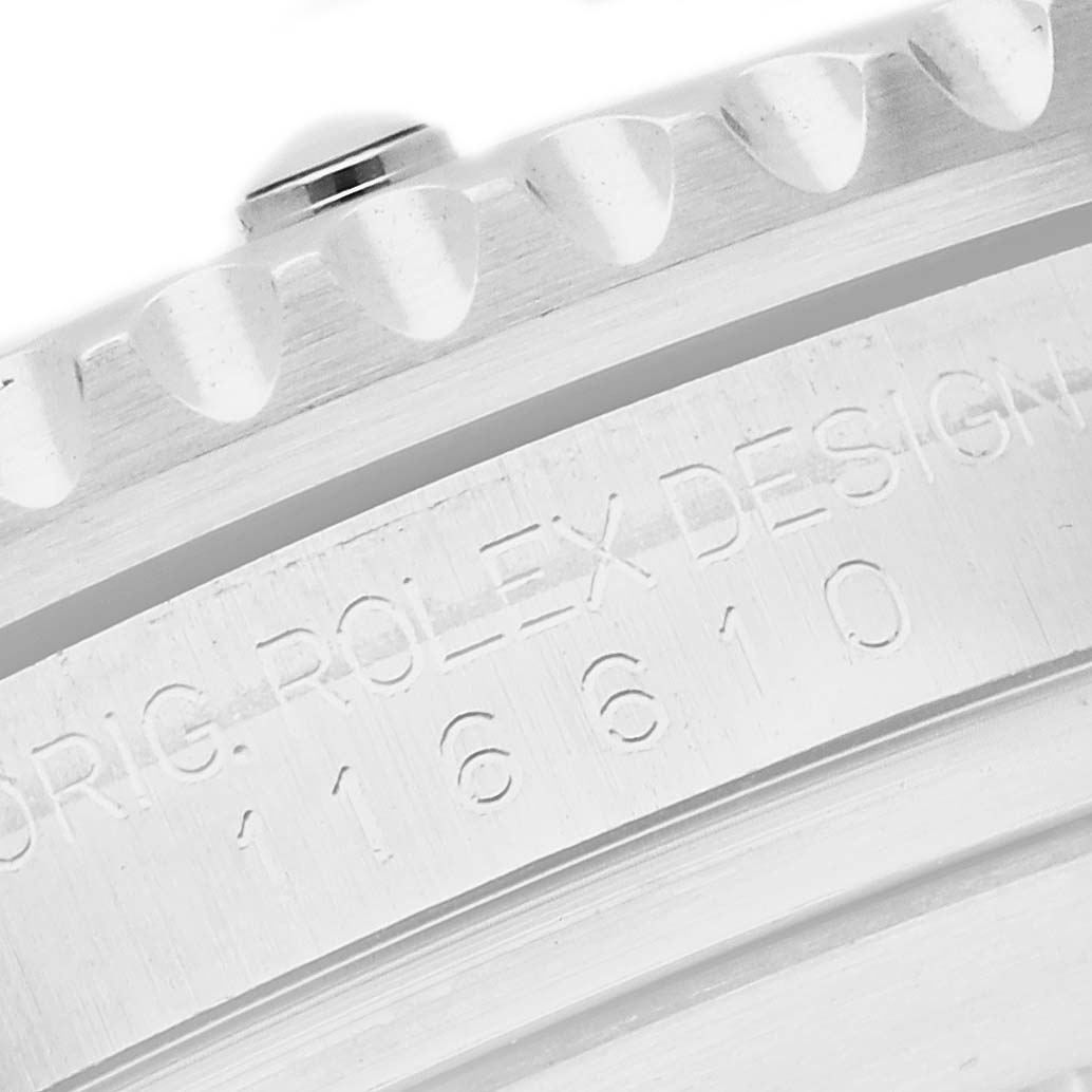 The image shows a close-up of the engraved side of the case for a Rolex Submariner, model 116610LV, displaying the design and model number.