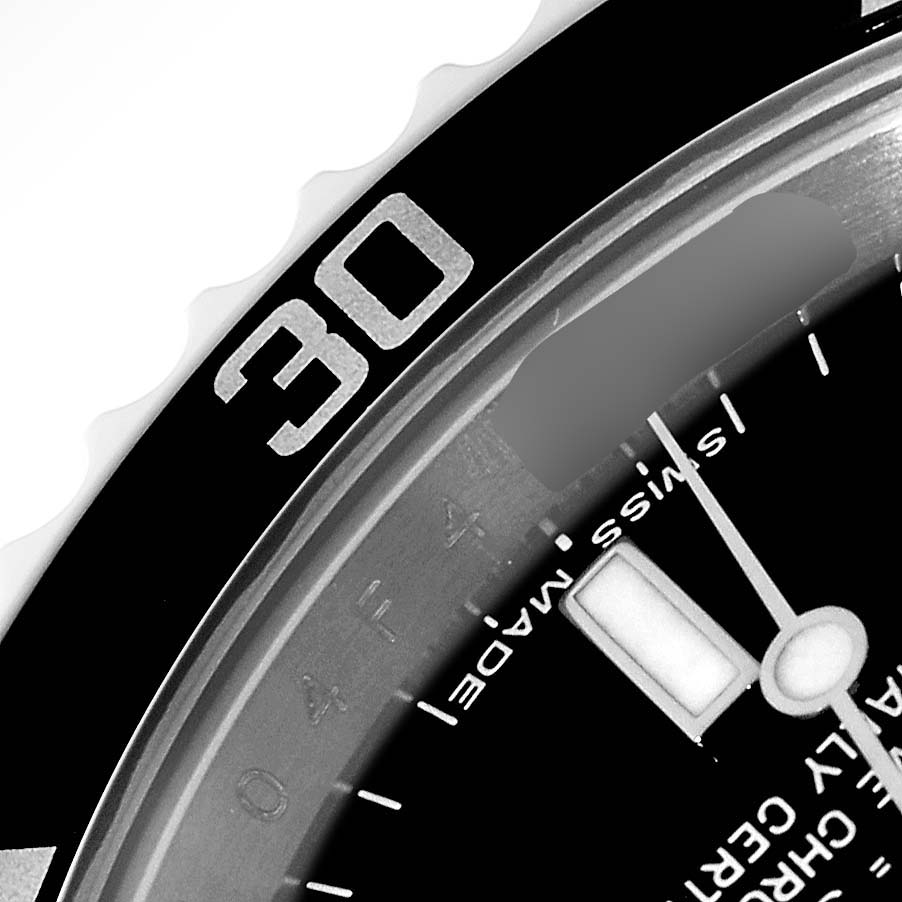 This close-up image of a Rolex Submariner 14060 Men
s Stainless Steel Black Dial 14060 Men
s Stainless Steel Black Dial shows part of the watch
s bezel and dial at an angled view.