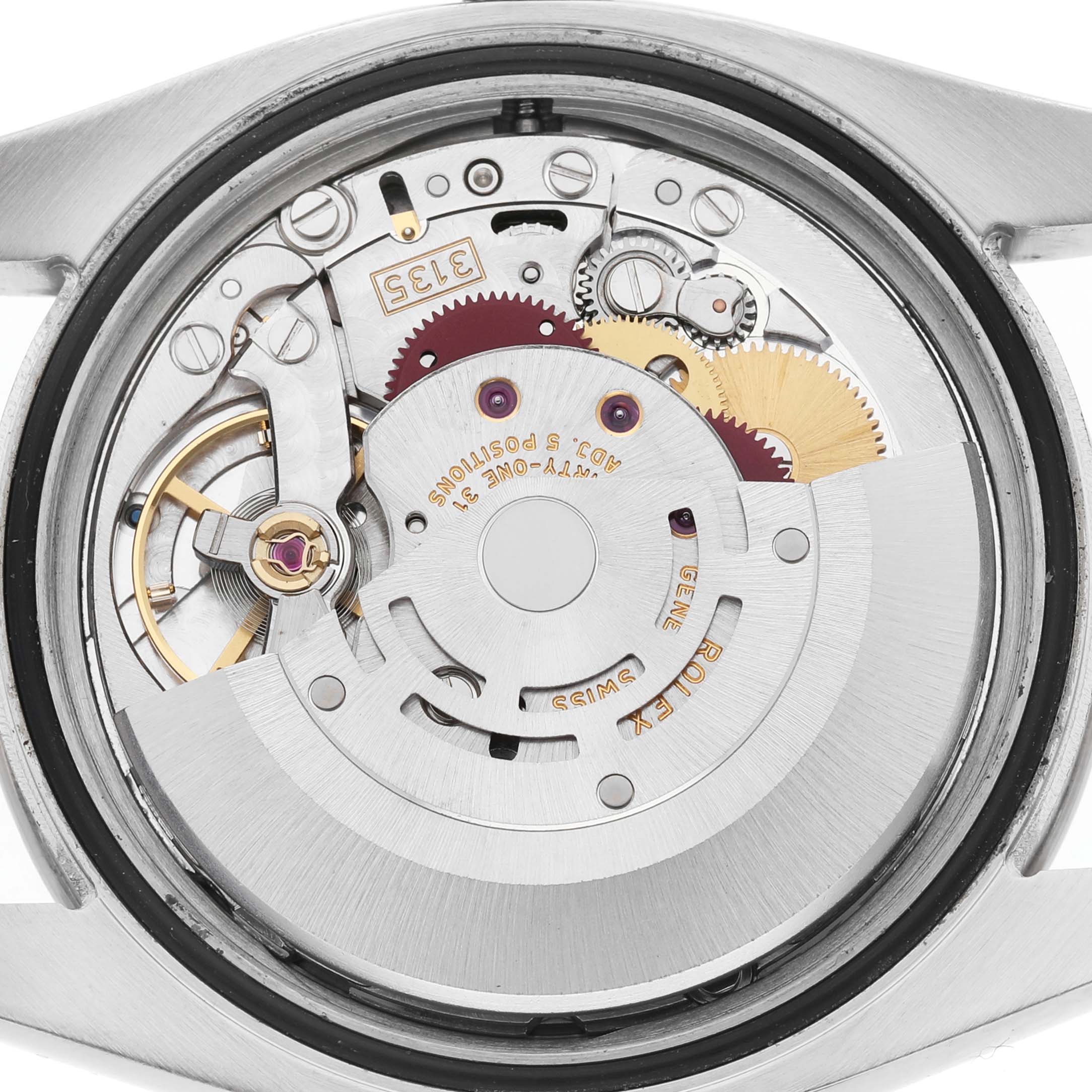 The image shows the back view of a Rolex Turn-o-Graph 116264 Men's Stainless Steel White Dial watch, highlighting the inner mechanics and movement components.