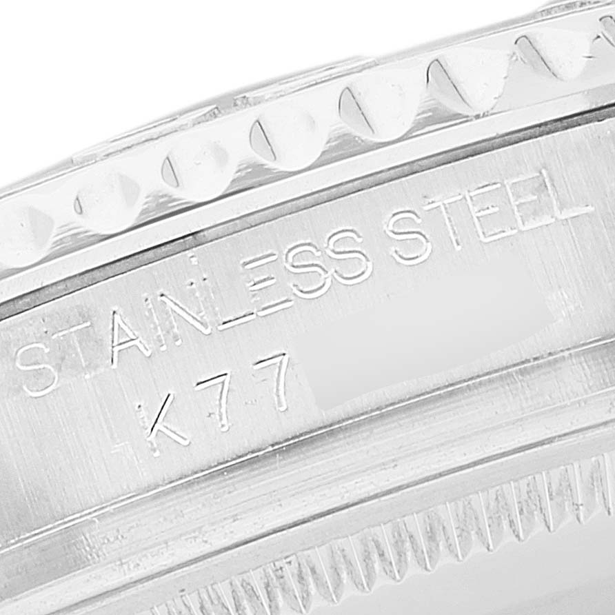 This close-up of a Rolex Yacht-Master 168622 Men's Stainless Steel Silver Dial 168622 Men's Stainless Steel Silver Dial watch shows the engraved "STAINLESS STEEL" text on the side of the watch case.