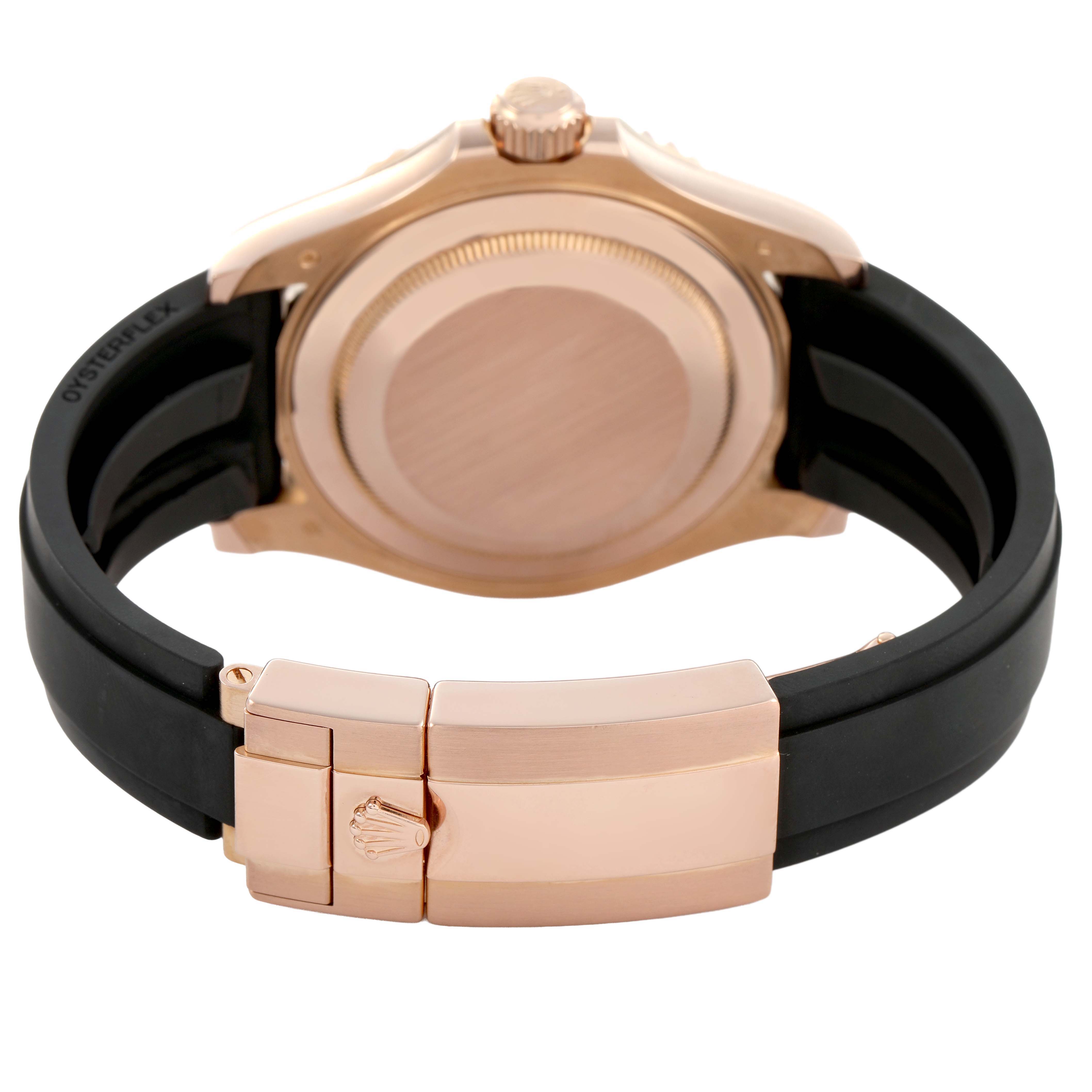 The image shows the back and clasp of a Rolex Yacht-Master 116655 Men's Rose Gold Black Dial watch with a black strap and rose gold case.