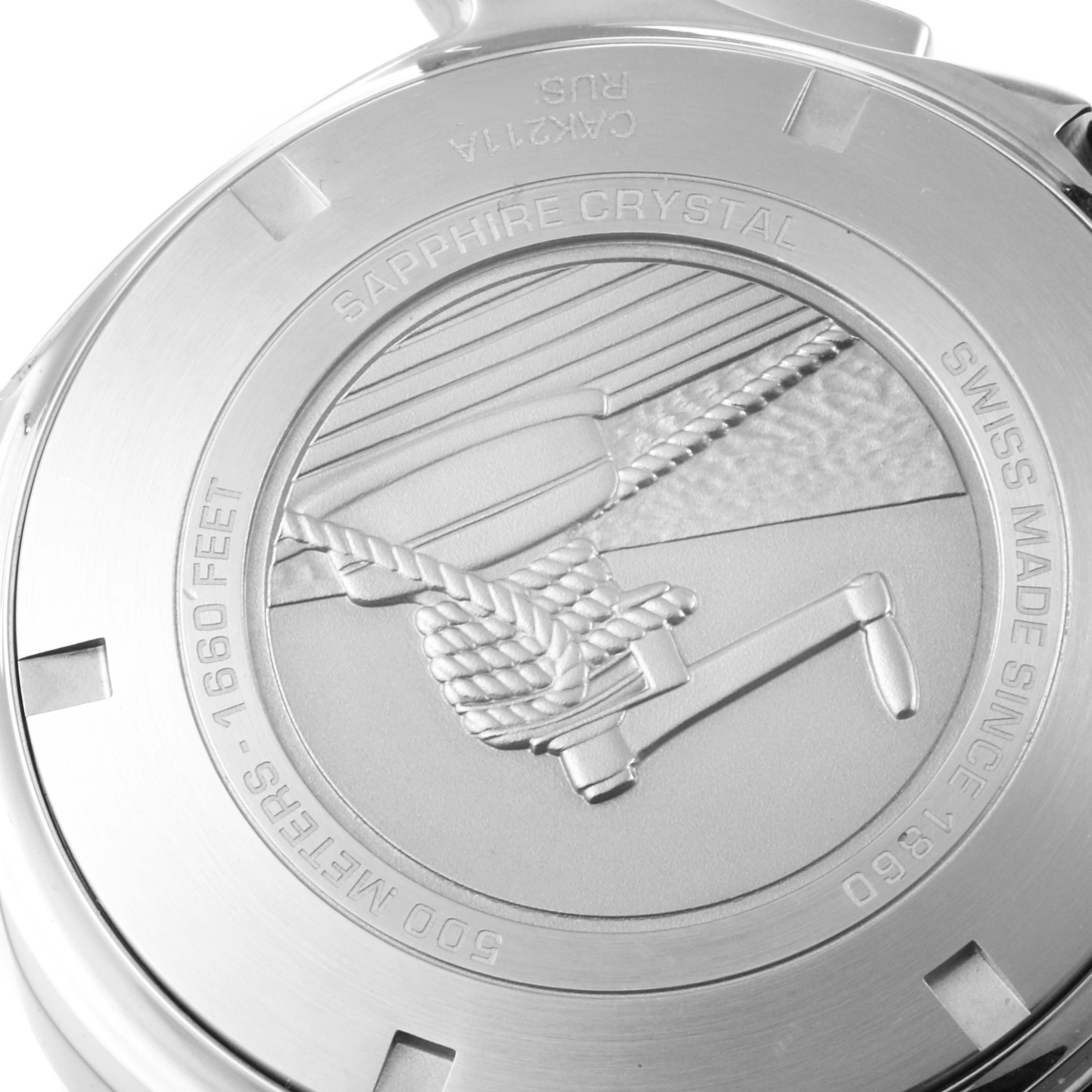 This image shows the back case of a Tag Heuer Aquaracer CAK211A Men's Stainless Steel Black Dial CAK211A Men's Stainless Steel Black Dial watch, highlighting its embossed design and markings.