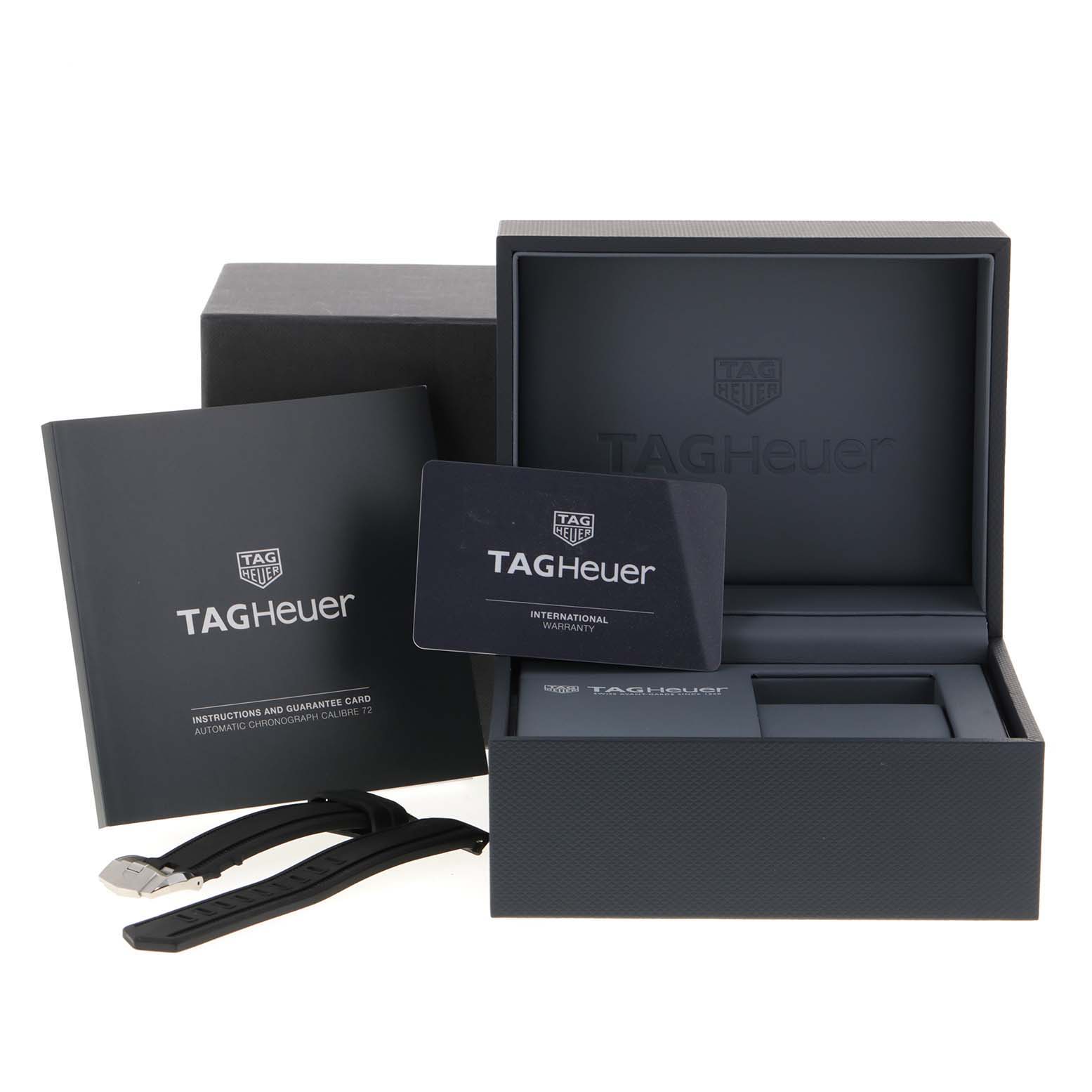 The image shows the packaging, instruction manual, warranty card, and extra strap for the Tag Heuer Aquaracer CAK211A Men's Stainless Steel Black Dial CAK211A Men's Stainless Steel Black Dial model.