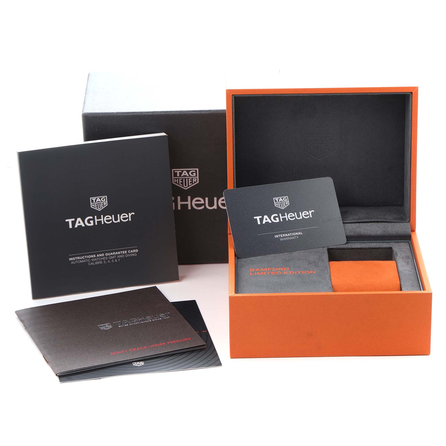 The image shows packaging and accessories for the Tag Heuer Aquaracer model WAY208F.BF0638, including a box, warranty card, and instruction manuals.