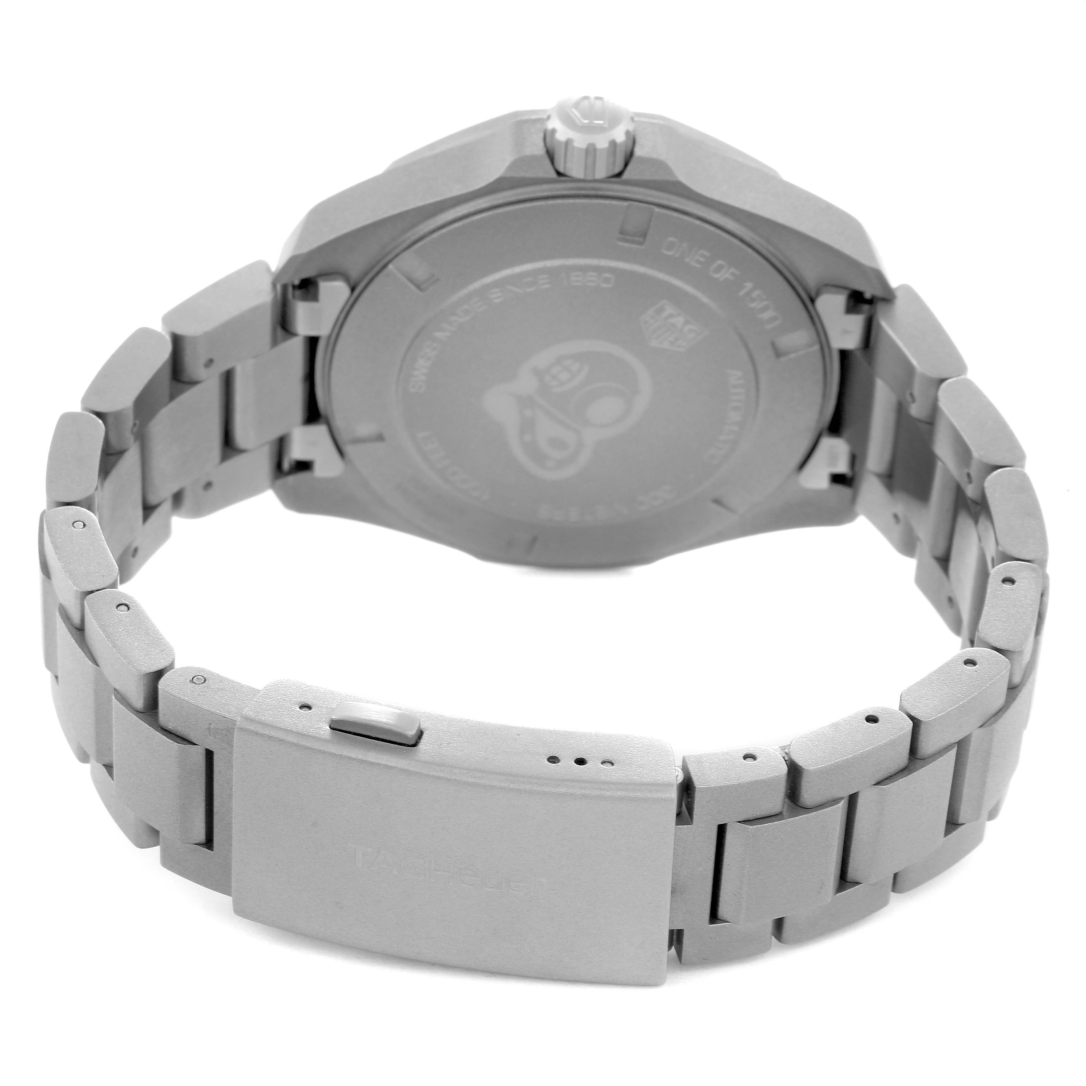The image shows the back of the Tag Heuer Aquaracer WAY208F.BF0638 watch with a focus on the case back, crown, and metal bracelet with the clasp.