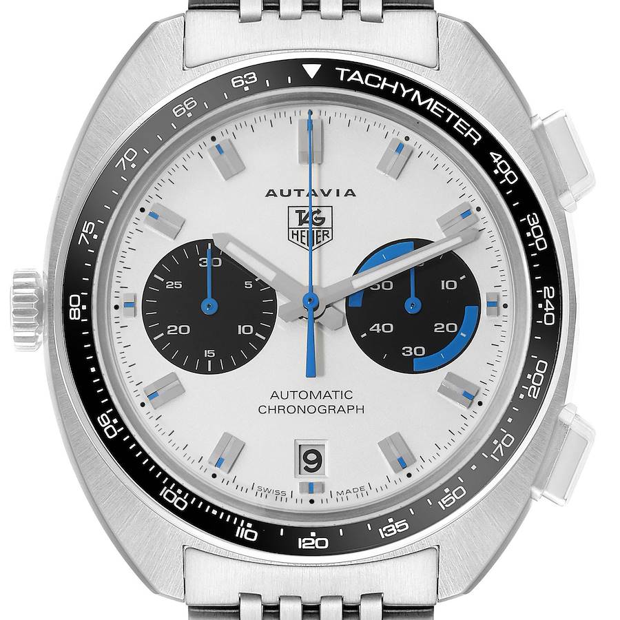 The image shows a close-up view of the dial and bezel of a Tag Heuer Autavia model, highlighting the tachymeter, chronographs, and date display.