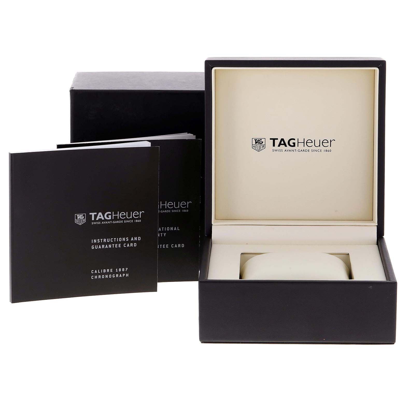 The image shows the packaging and accessories of a Tag Heuer Carrera CAR2013.FC6313 Men
s Stainless Steel Black Dial CAR2013.FC6313 Men
s Stainless Steel Black Dial watch, including the box, instruction manual, and guarantee card.