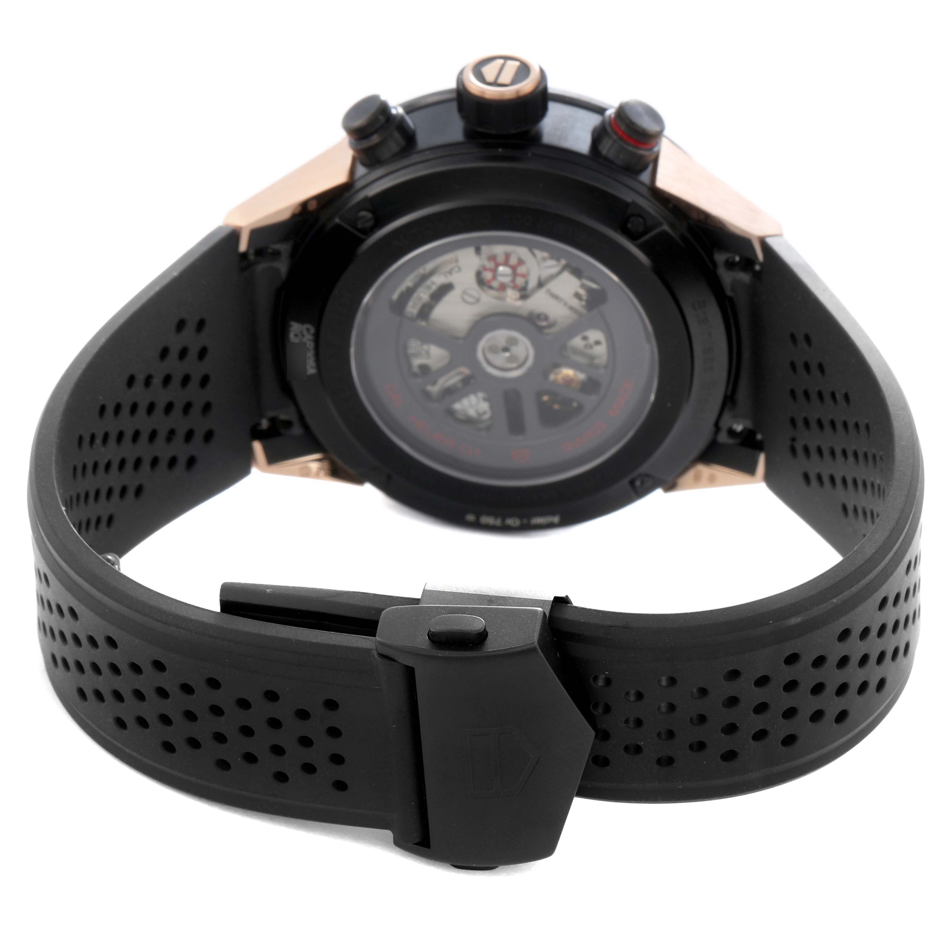 The image shows the back view of a Tag Heuer Carrera model CAR205A.FT6087 men's watch, highlighting the transparent case back and perforated black strap.