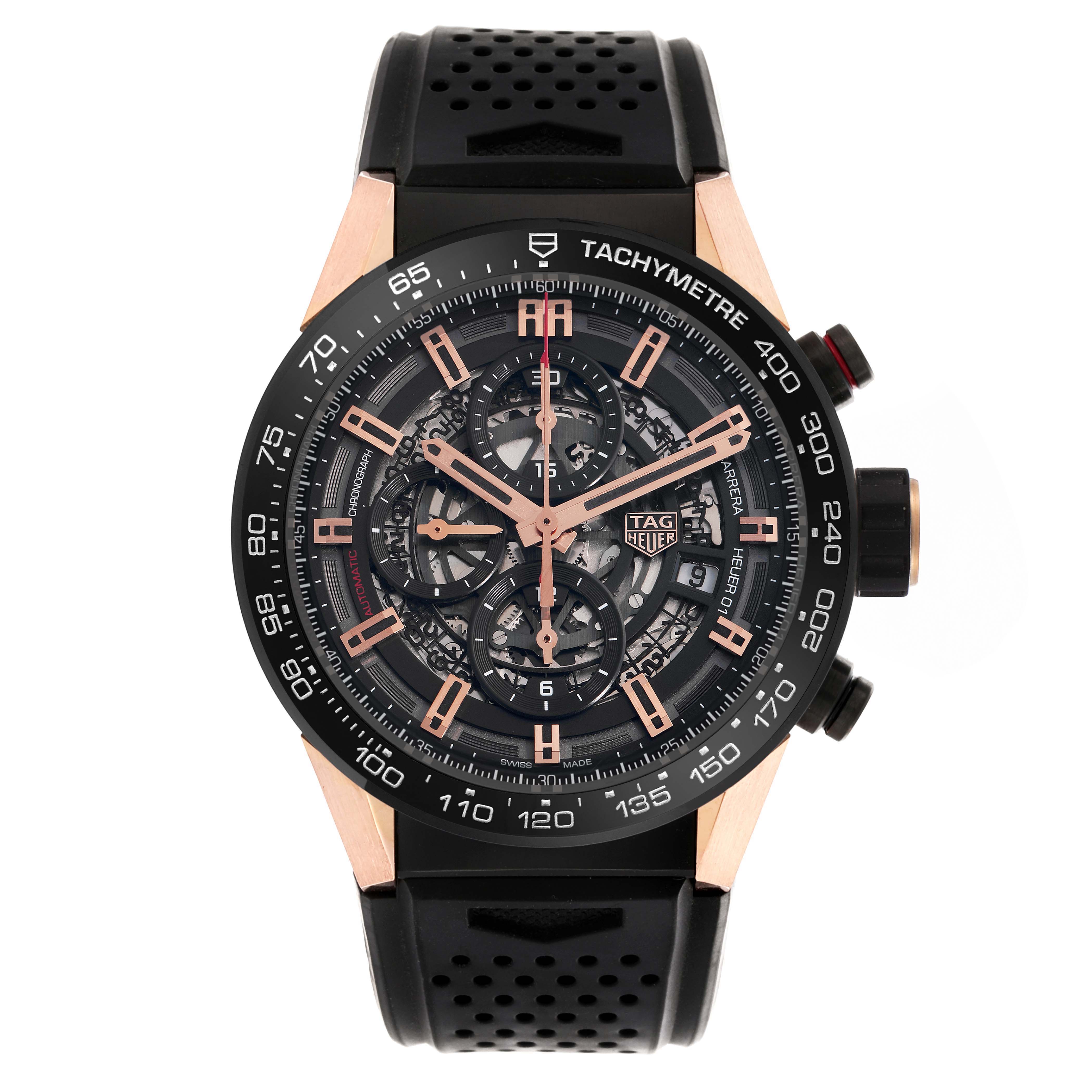 The Tag Heuer Carrera model CAR205A.FT6087 is shown from a front angle, displaying its intricate dial, tachymeter bezel, and perforated black strap.