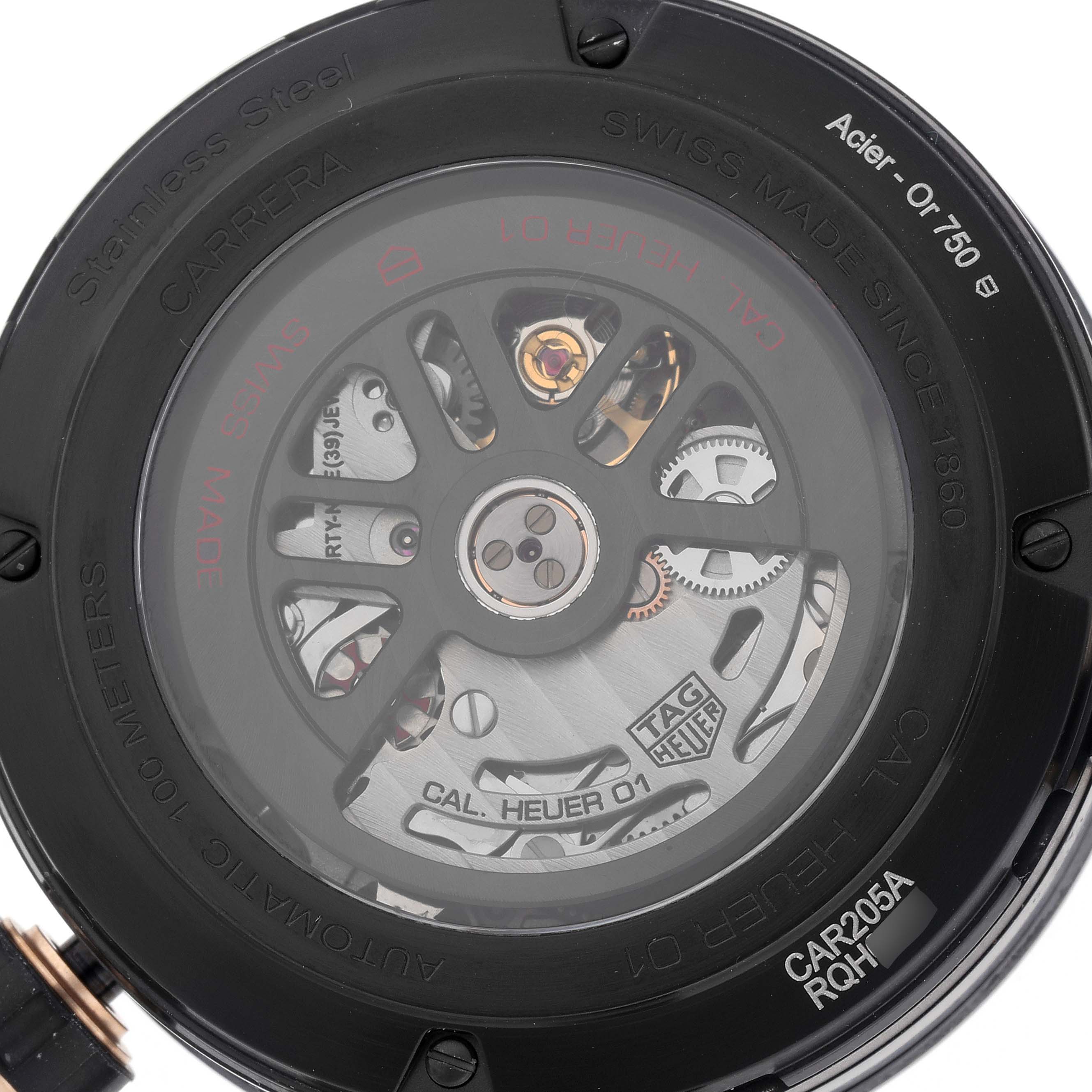 The image shows the rear view of the Tag Heuer Carrera model, model number CAR205A.FT6087, focusing on the movement and engraved details on the case back.