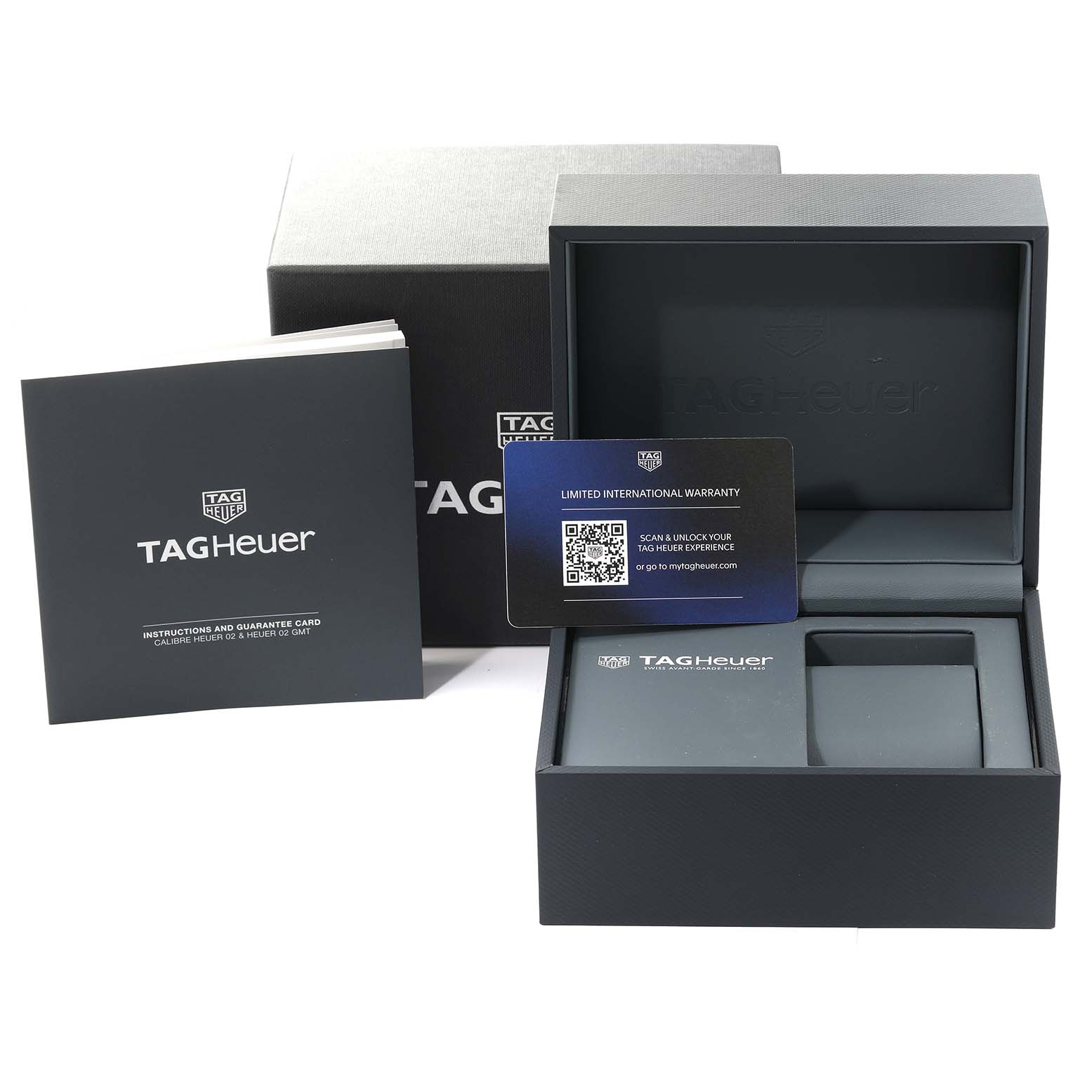 The image shows the packaging and accessories for a Tag Heuer Carrera CBS2216 Men
s Stainless Steel Silver Dial CBS2216 Men
s Stainless Steel Silver Dial model, including the box, warranty card, and instruction booklet.